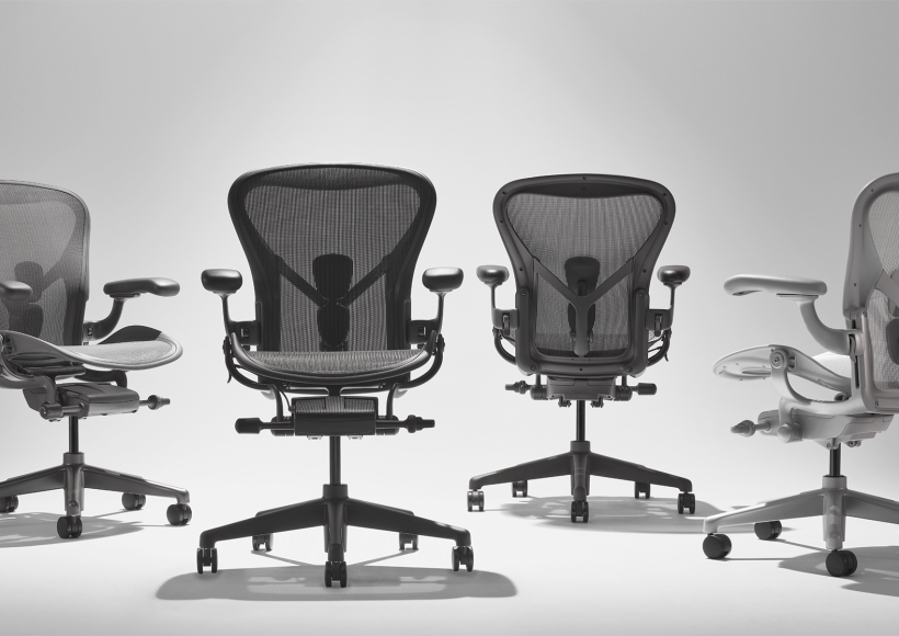 aeron resmastered set of chairs in a whote room with dimmed light
