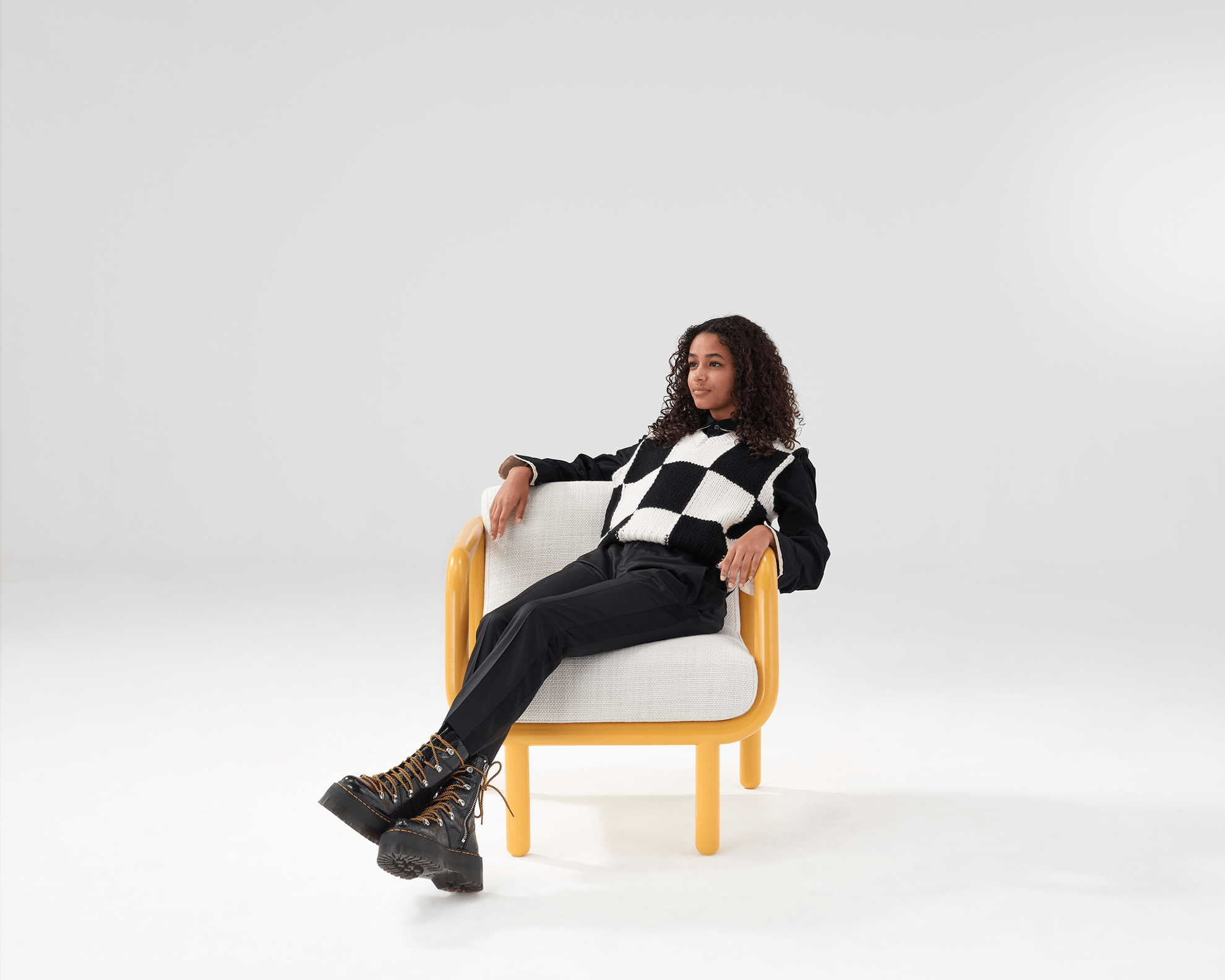 model seating in a percy lounge chair at workarena