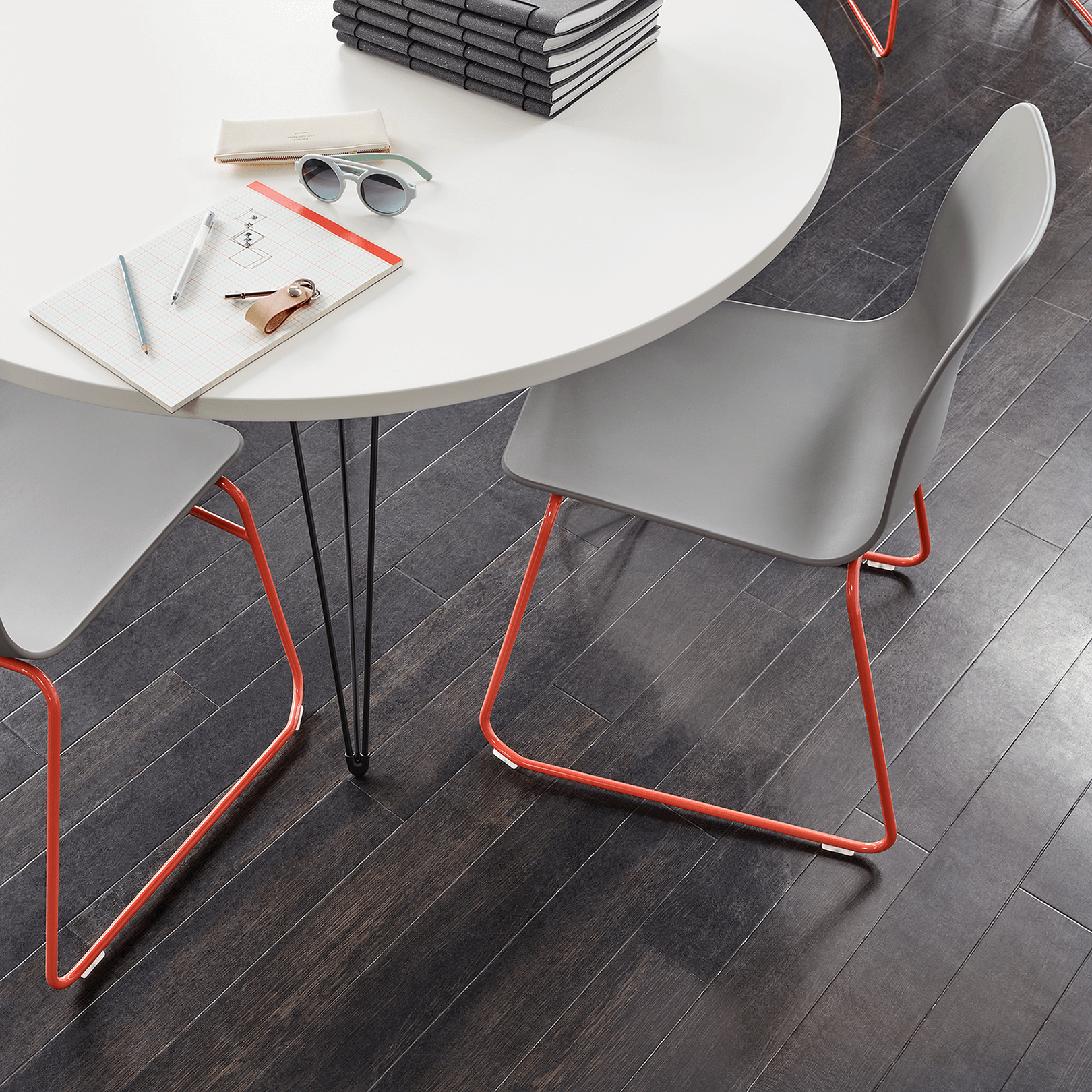 a green Polly stacking chair from naughtOne in a school room