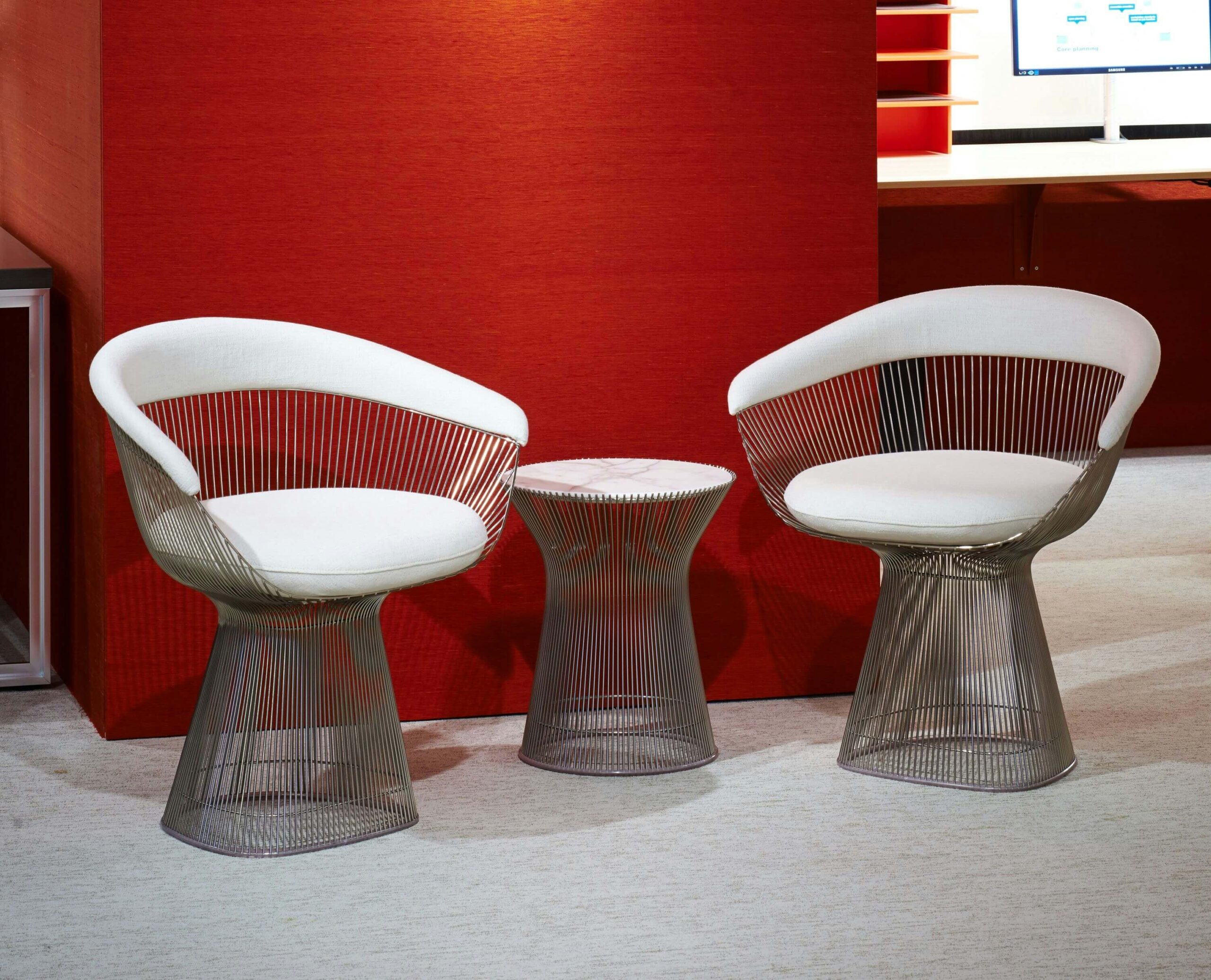 Platner Arm side chair in an office lobby design
