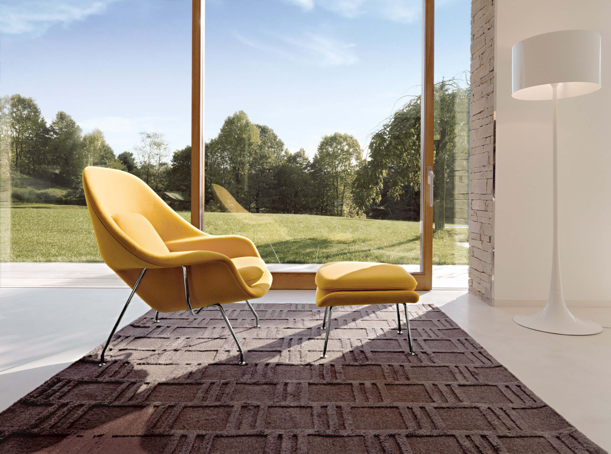 Womb Chair next to a big window in a elegant house