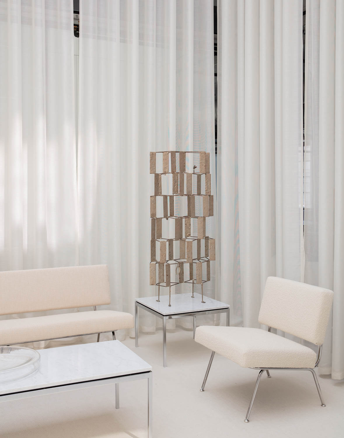 Florence Knoll Model 33 sofa and white chair