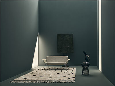 KN05 Settee Sofa in an elegant dark room with light ray