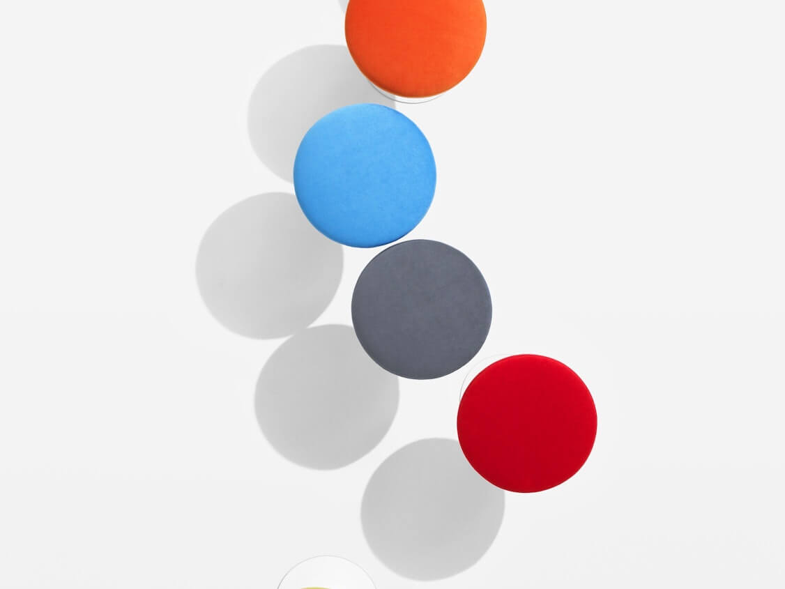 Tulip Side Stool from the top in various colours in a white floor