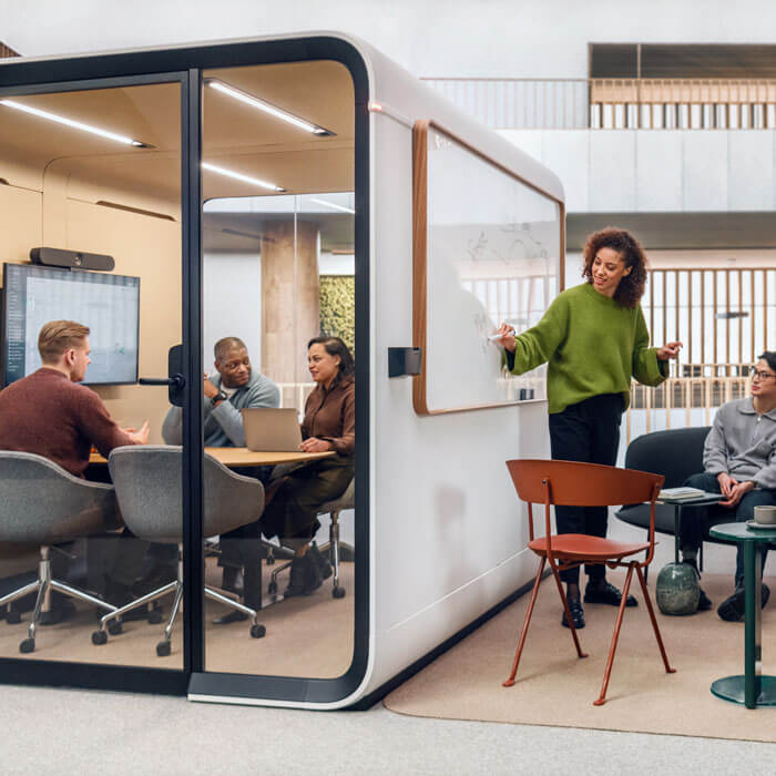 a framery booth featuring a wall as a white board