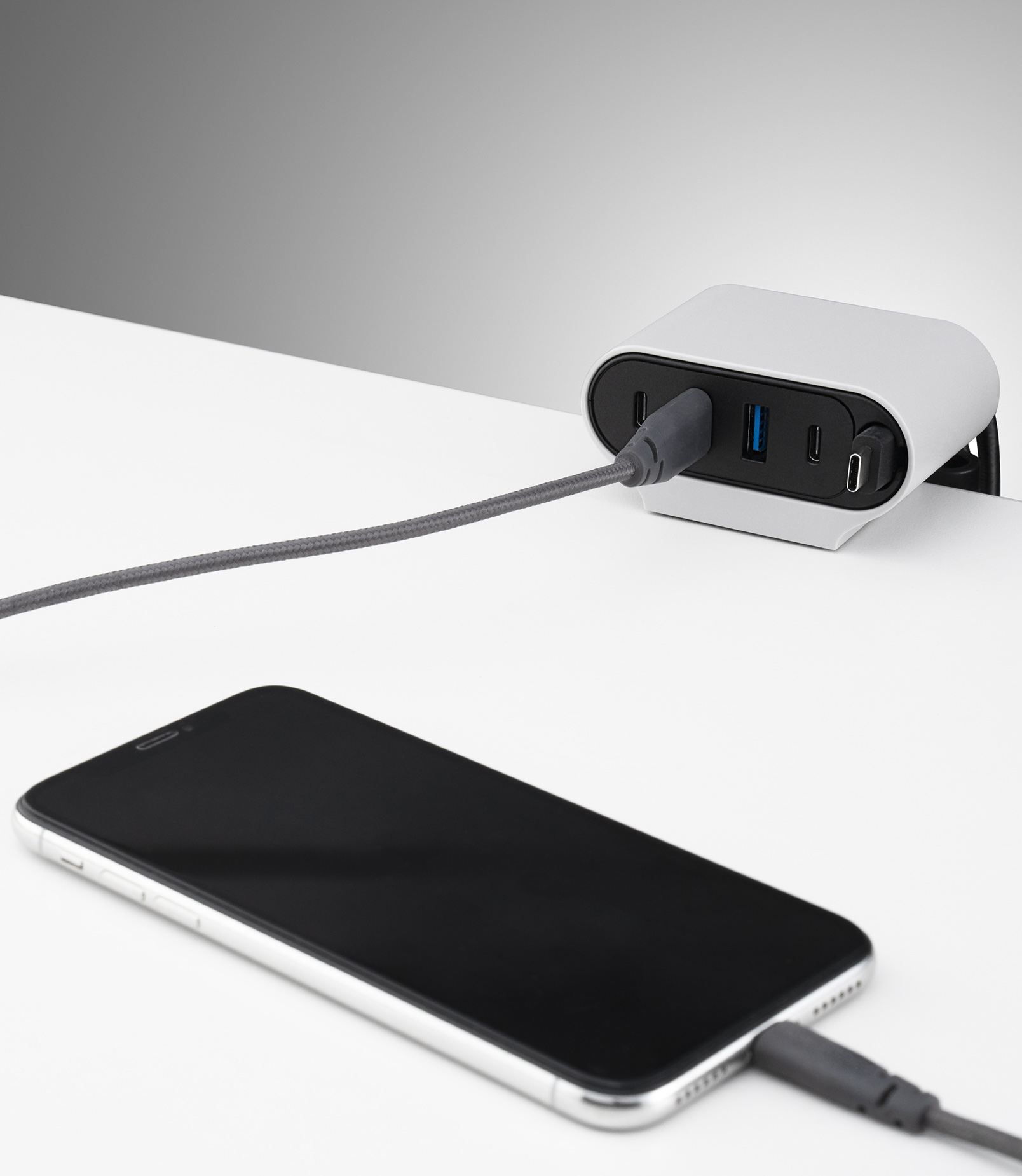 Ondo Data and Power Management Mount charging a mobile phone