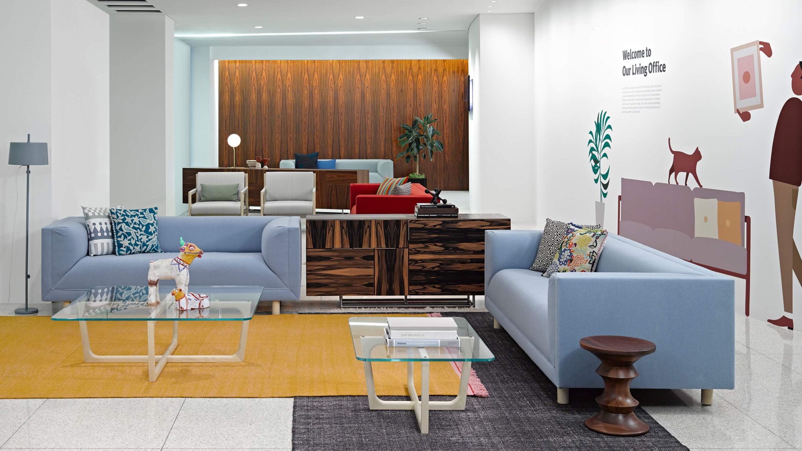 Brabo Sofa and Settee in a modern living room with a green rugg and two coffee tables