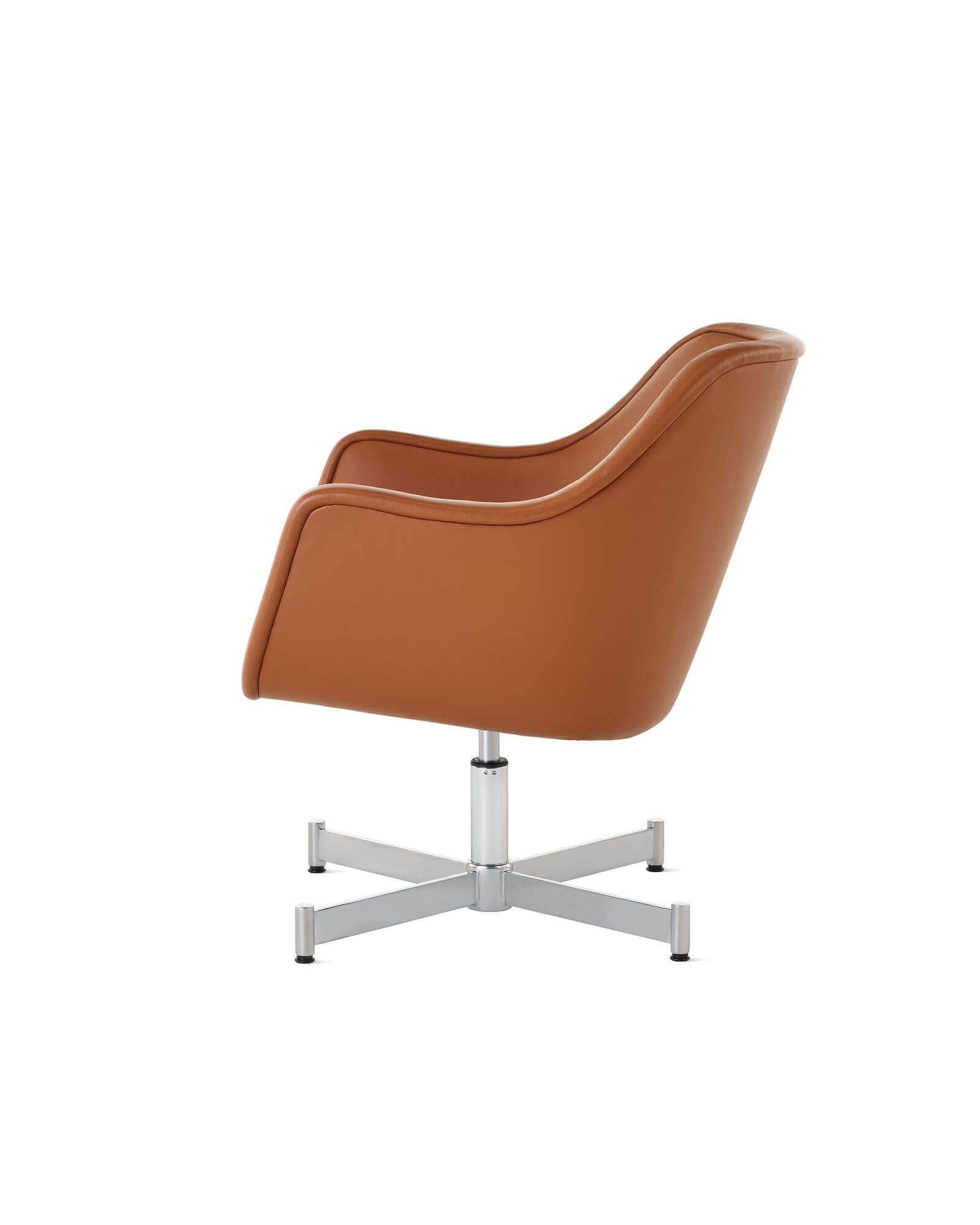 the side angle of a red Bumper Lounge Chair with a polished alumunium base in a white room