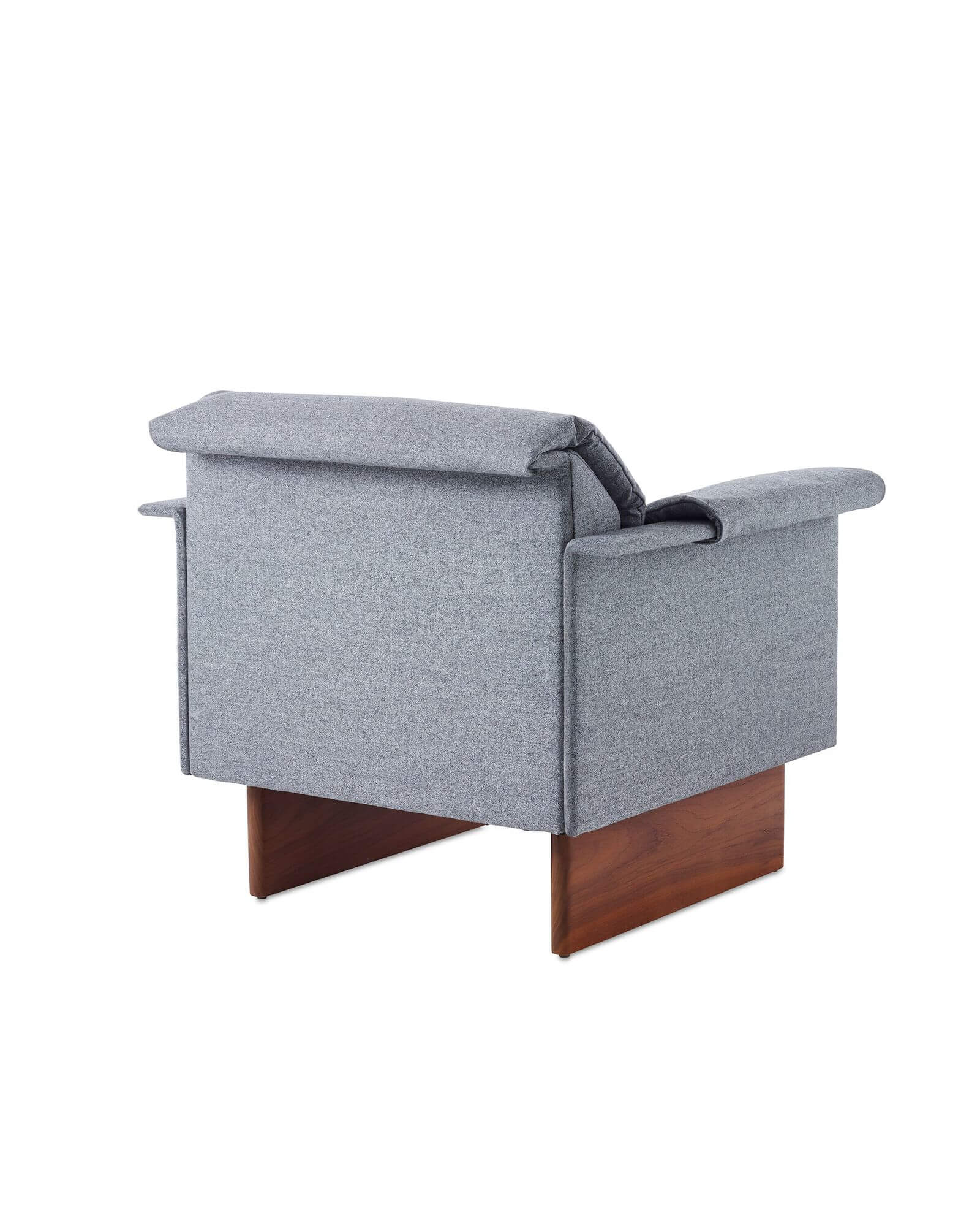 the back side angle of a Mantle Club Chair with a wooden base and light blue marle upholstery