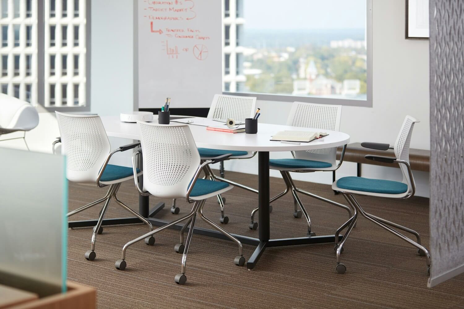 a rectangular white table with five white MultiGeneration Hybrid Base Chair