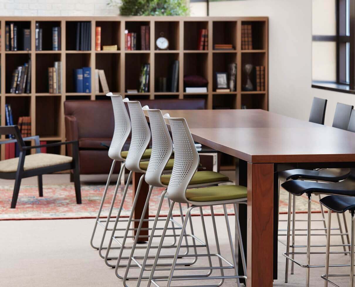 MultiGeneration Barstool Chair by Knoll next to a high table in a library