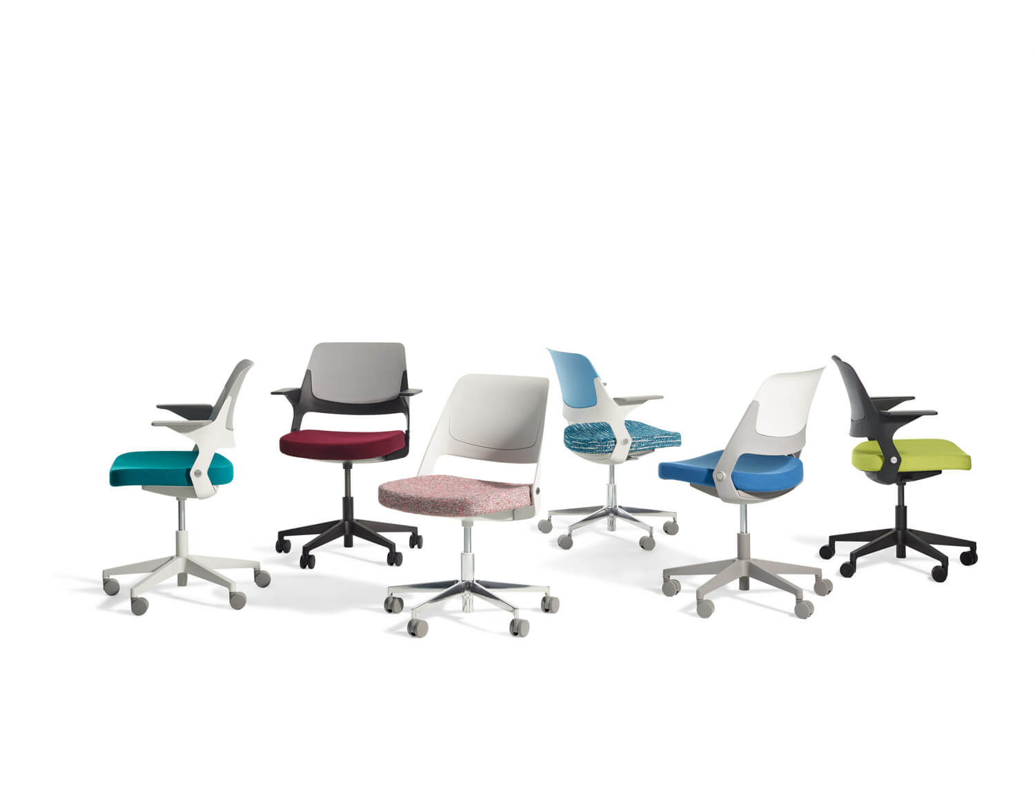 various styles and colours of the Ollo Side Chair in a white room