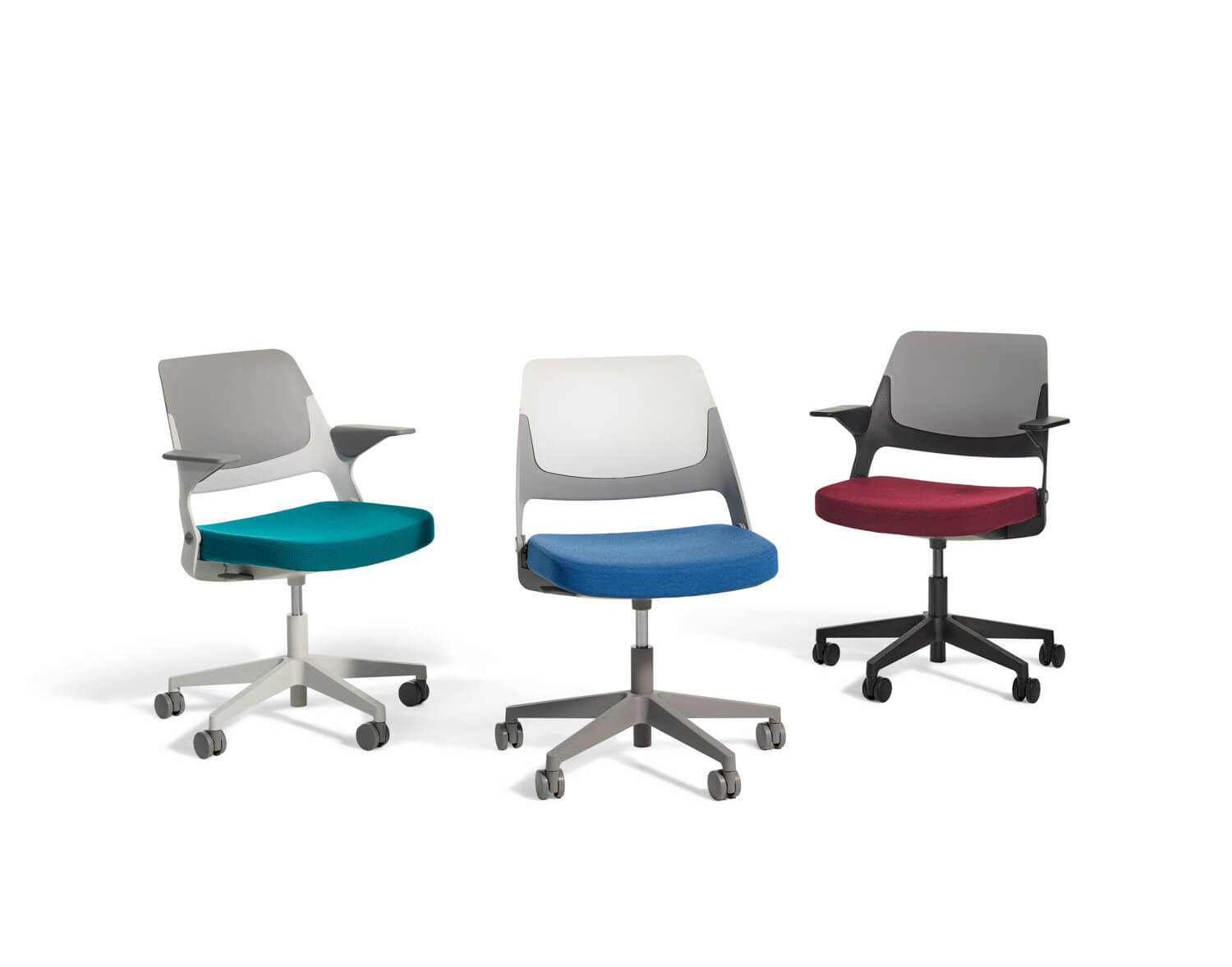 three diferent styles of the Ollo Side Chair in a white room