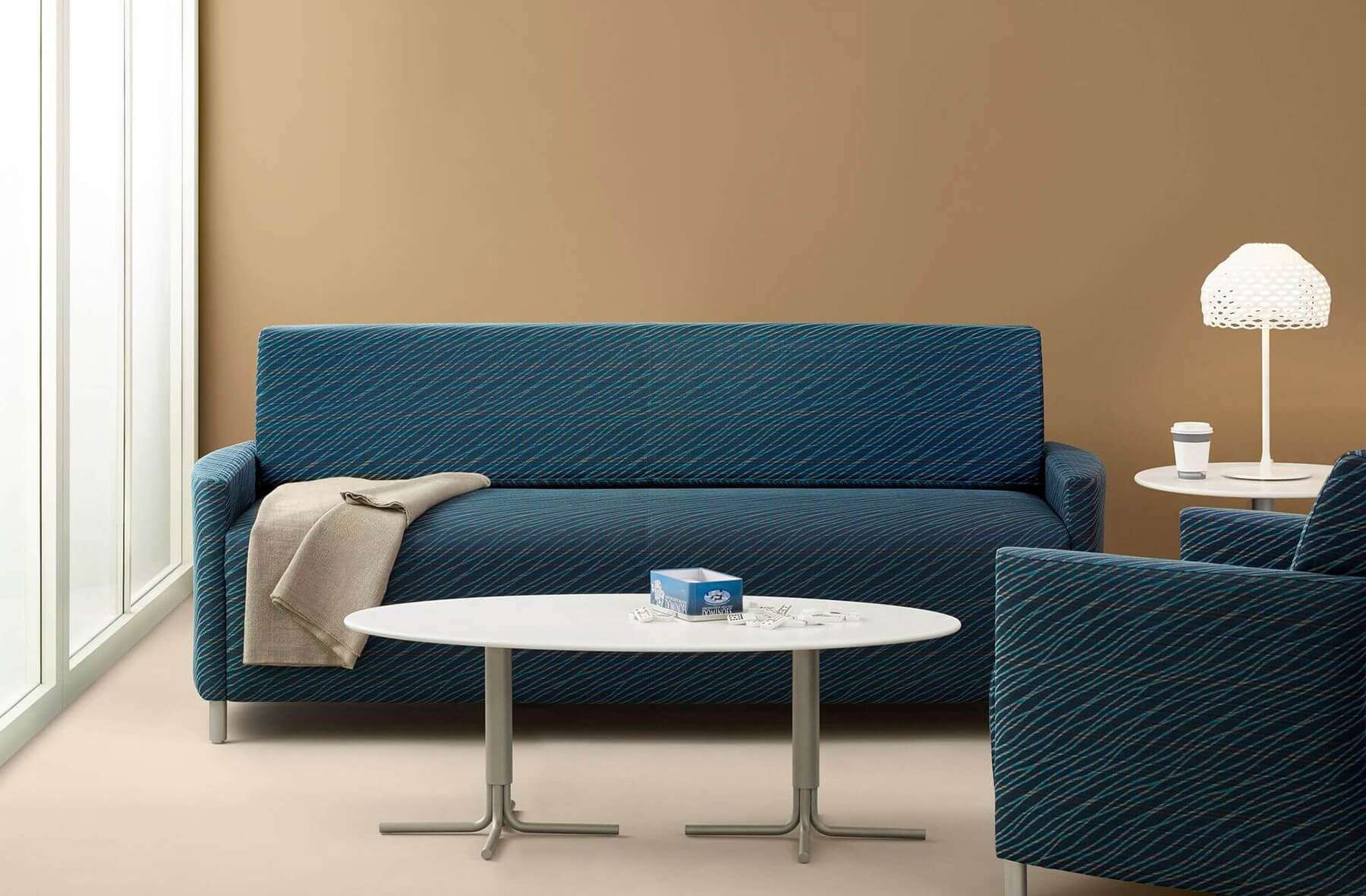 Pamona Flop Medical Sofa Bed in teal colour in a modern healthcare facility