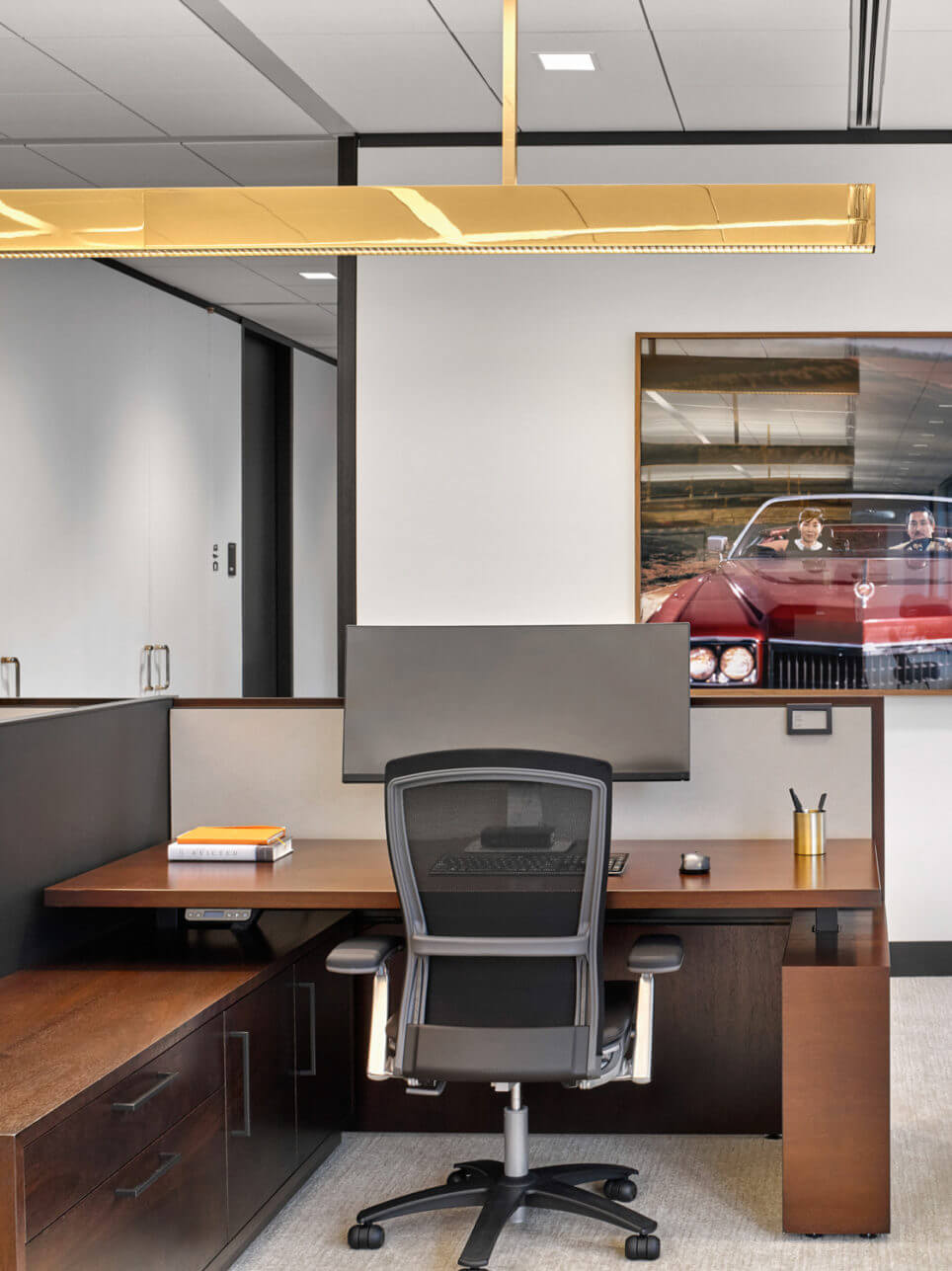 Reff Profiles Executive Stand Up Desk in a modern space with a big wondow and two side chairs