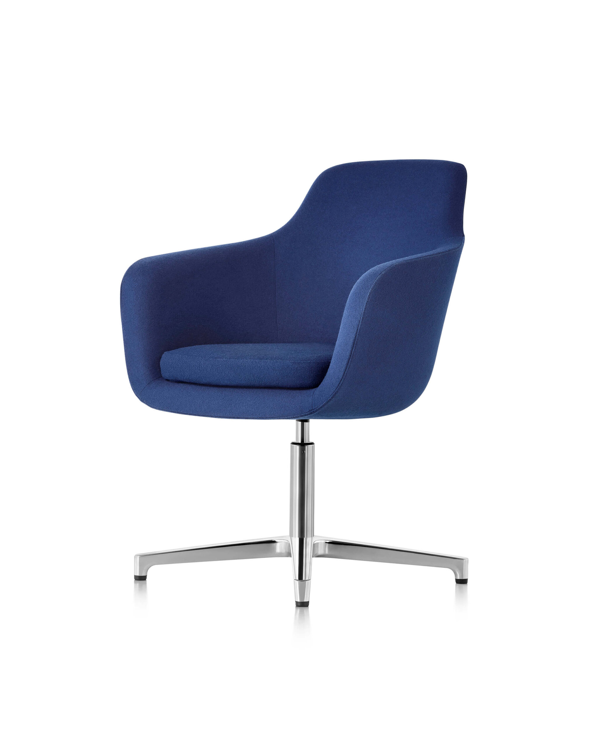 the front side angle of a blue low back Saiba Lounge Chair with polished aluminium base in a white room