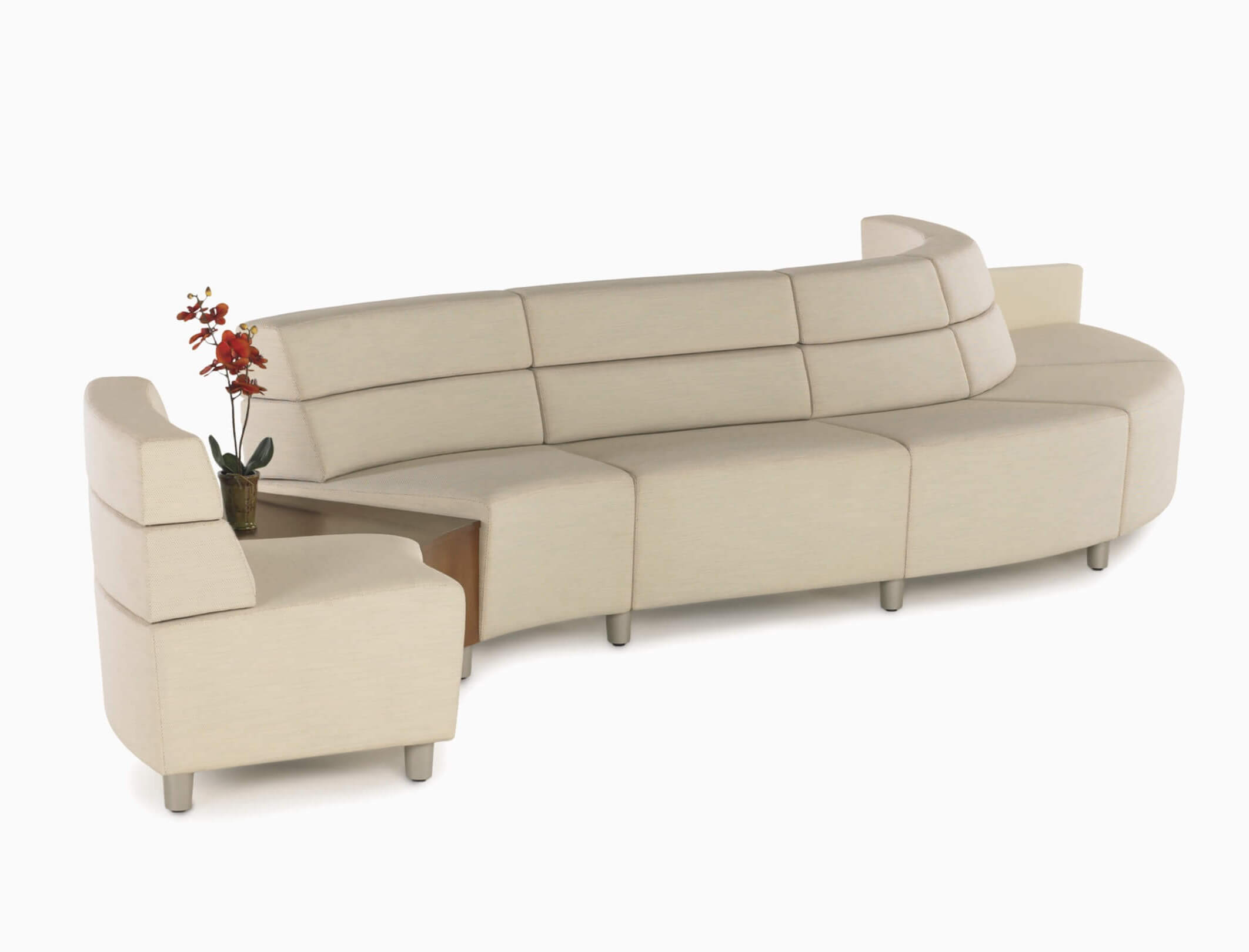 Steps Medical Lounge System with S shape in cream colour and a side table in the middle in a white room