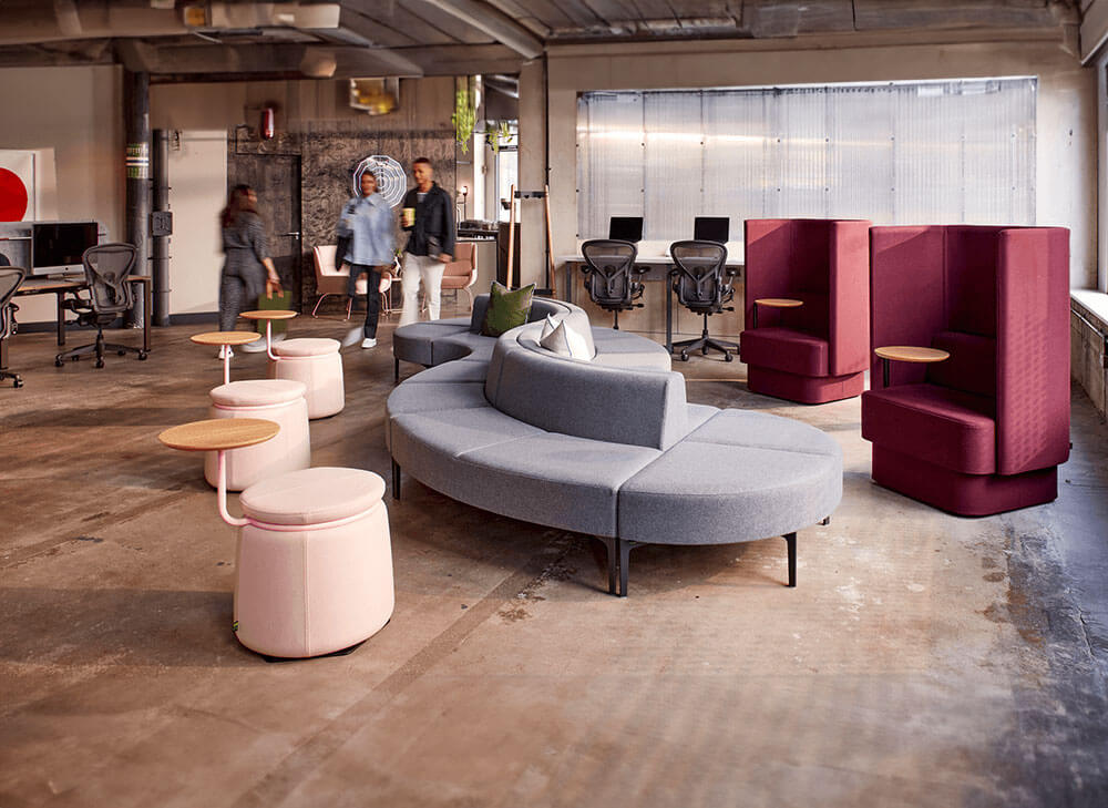 a modern australian office featuring single booths ergonomic chairs and a lounge soda in s shape