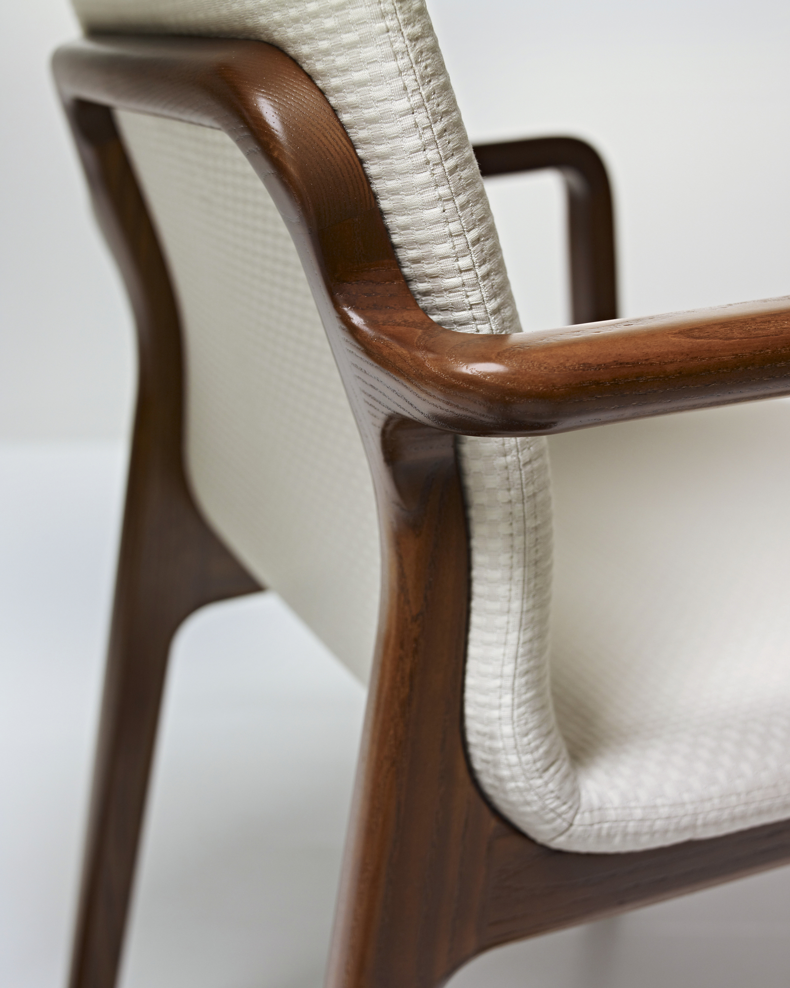the left side angle zoom of the arm detail of a Deft Side Chair