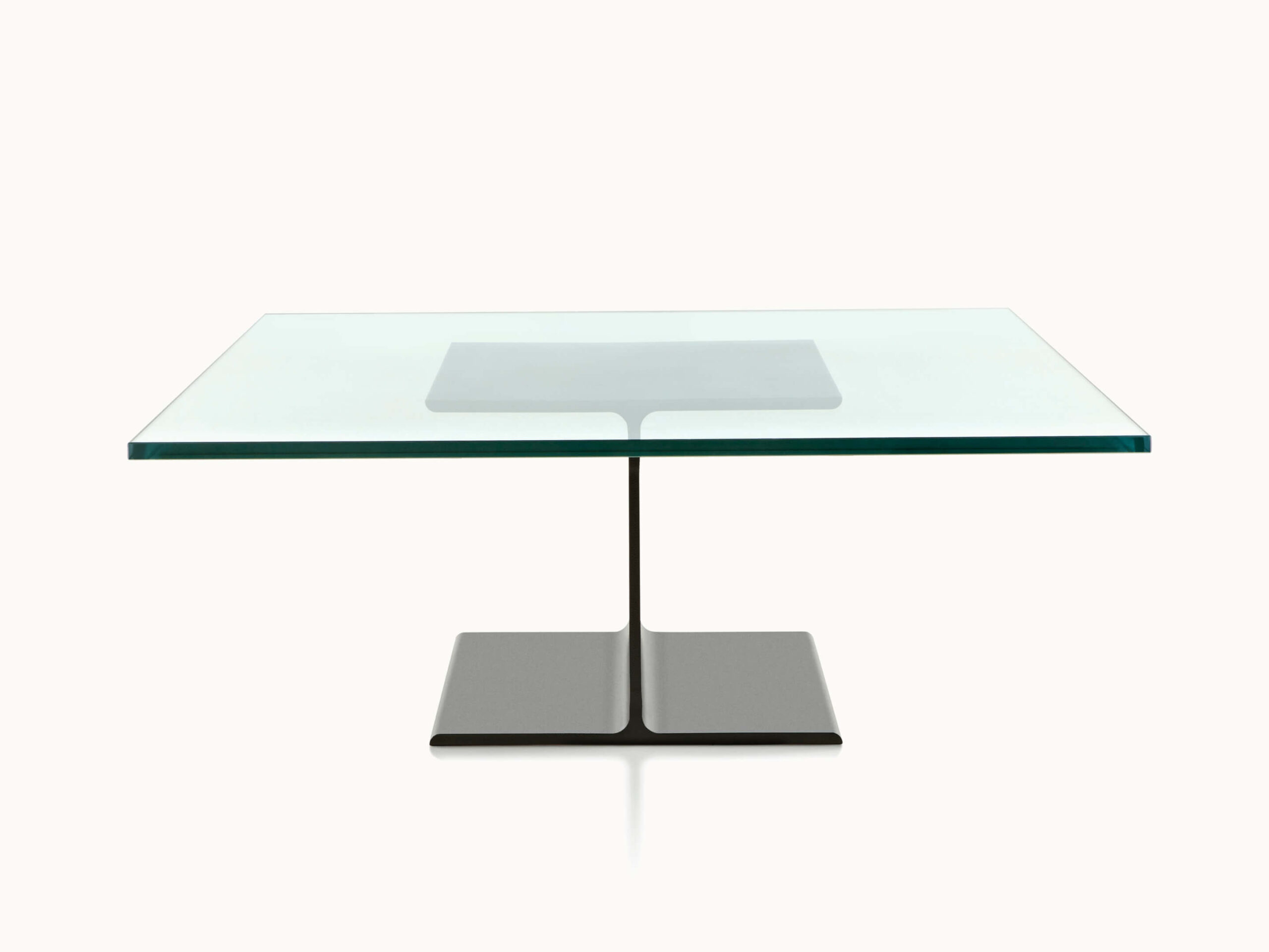 the front side of a glasstop I Beam Side Table in a white room