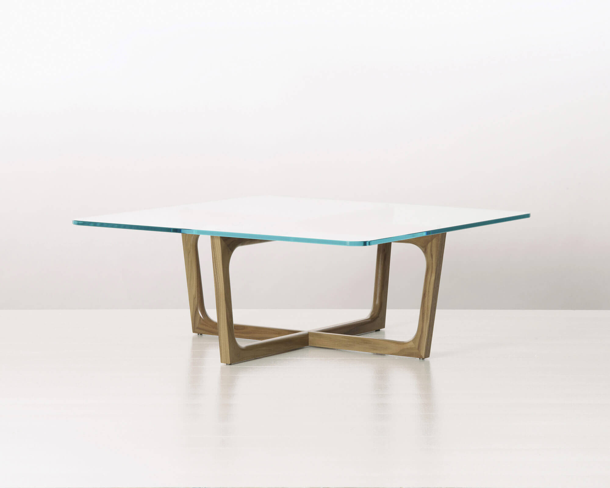 a squared Loophole Side Table view with glass top and oak wood in a white room