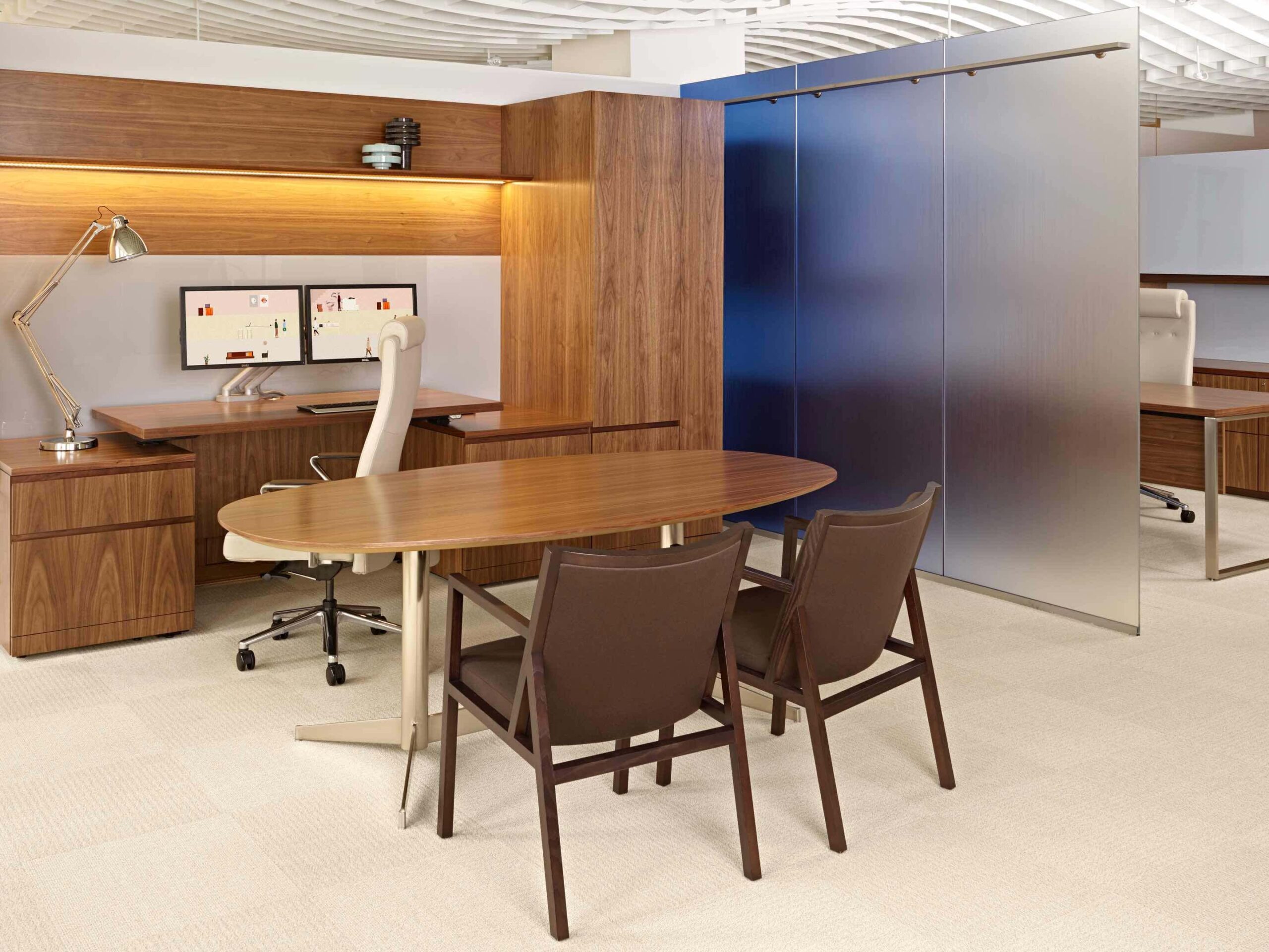 a modern office featuring a wooden top workstation and a wooden storage cabinet and two ascribe side armchairs
