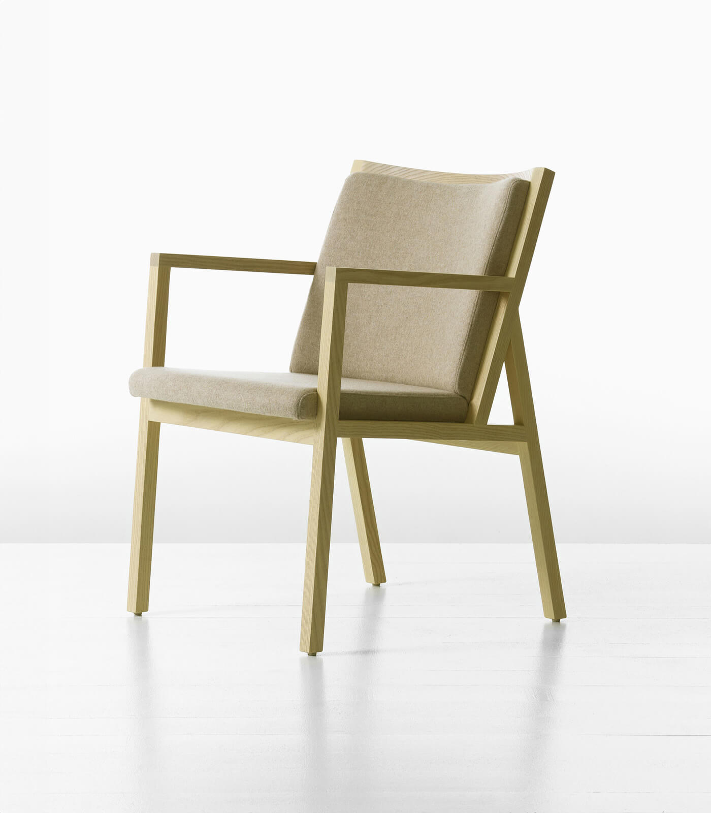 ascribe side armchairthe front side angle of a ascribe side armchair with white wood frame in a white room