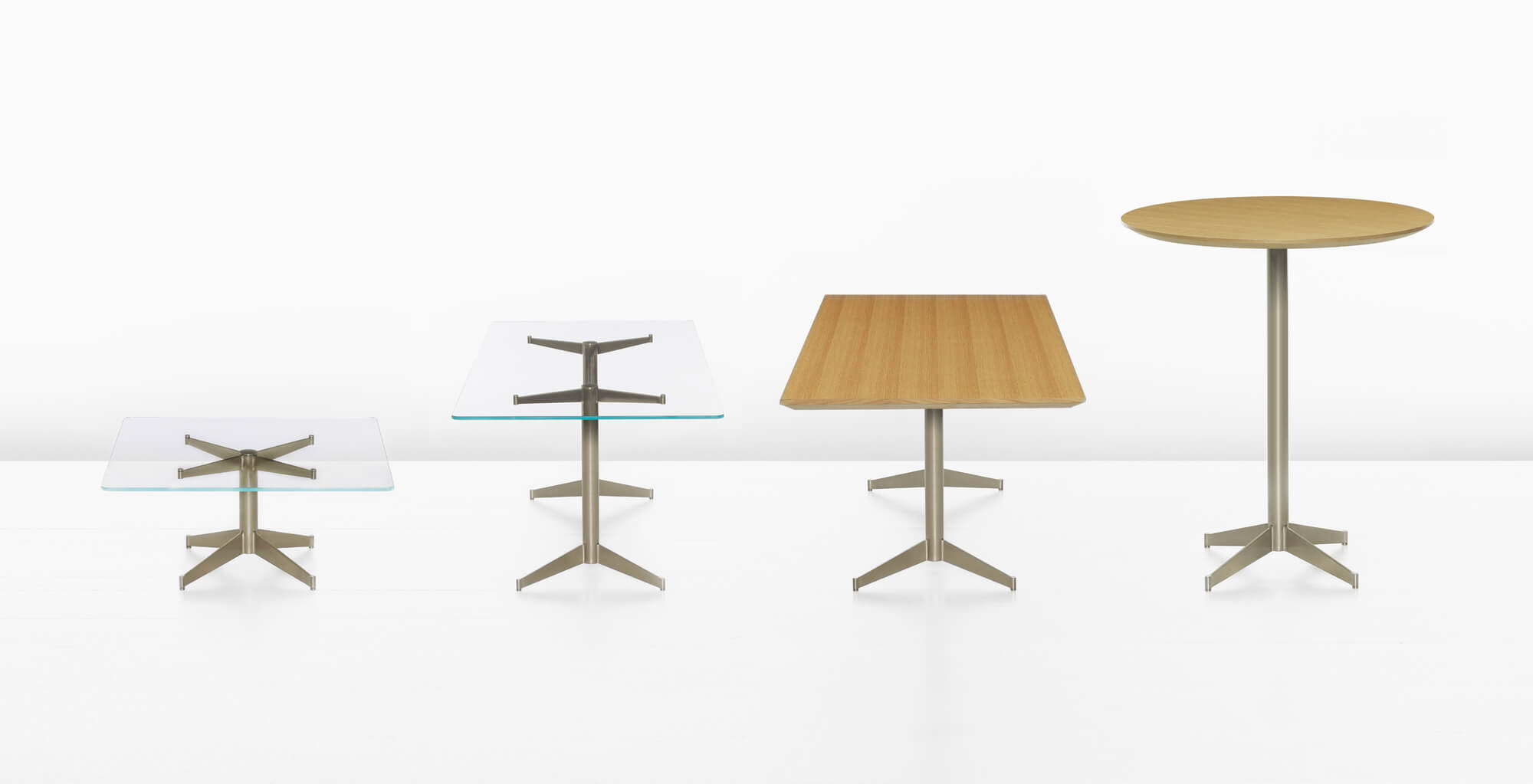 four different styles of the mp side table with metal base and wooden and glass options in a white room
