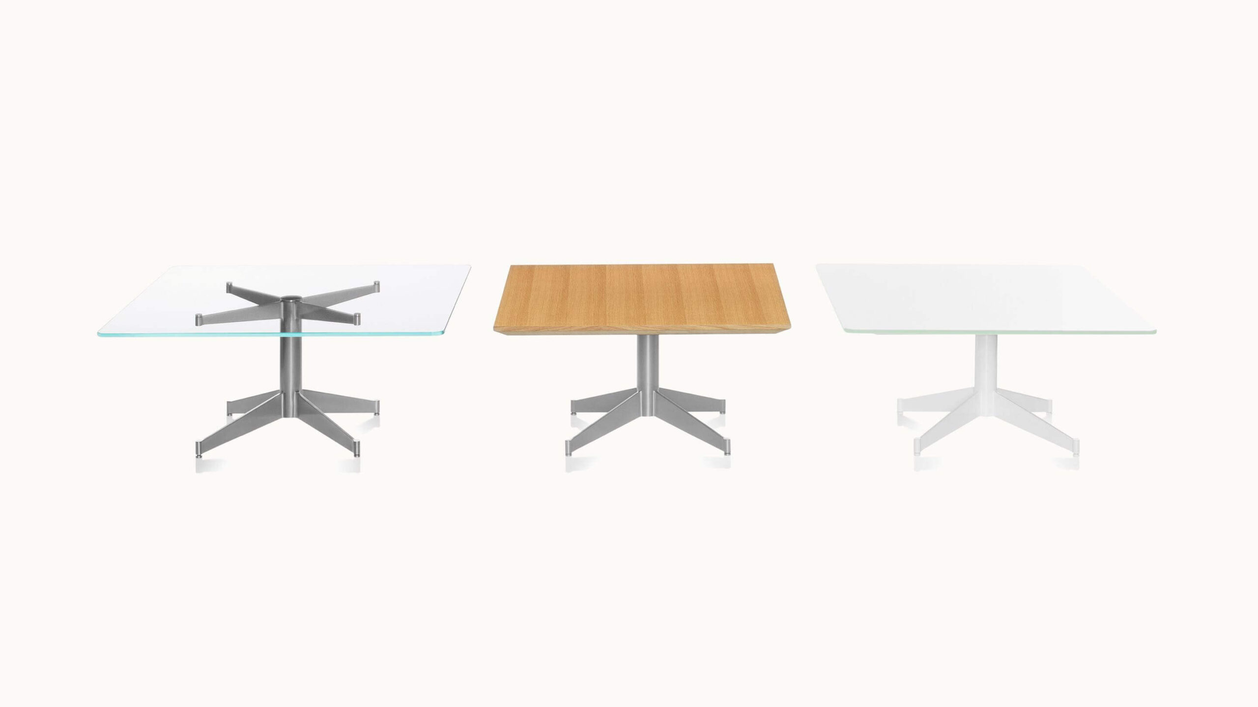 three different styles of the mp side table with metal base and wooden and glass options in a white room