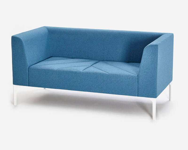 the front side angle of a two seat Hatch Modular Sofa with arms and wooden legs on a white room