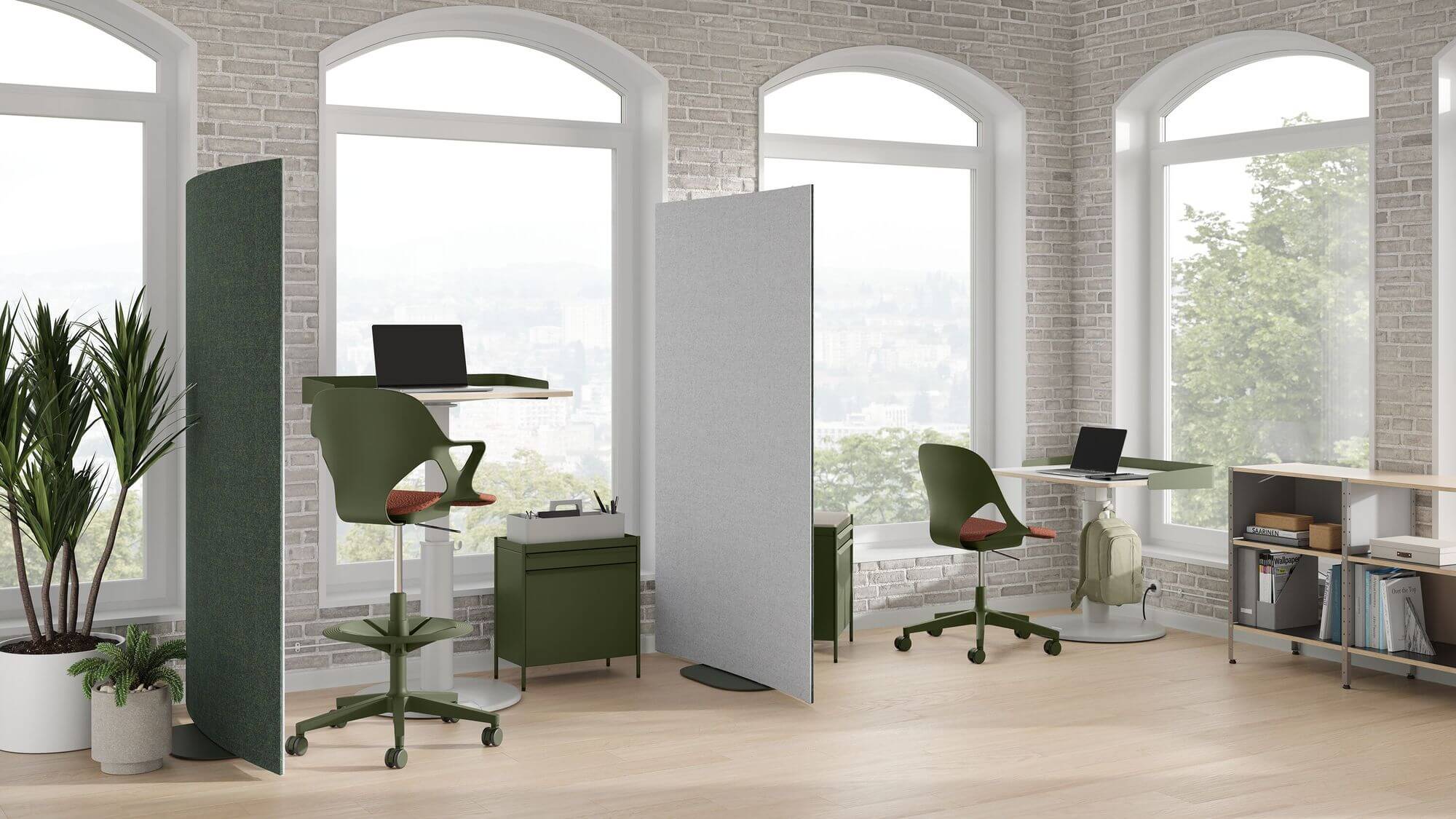 oe1 sit to stand table a modern office with brick walls and tall windows featuring it the right side next to a side chair, storage unit and plant on the left side