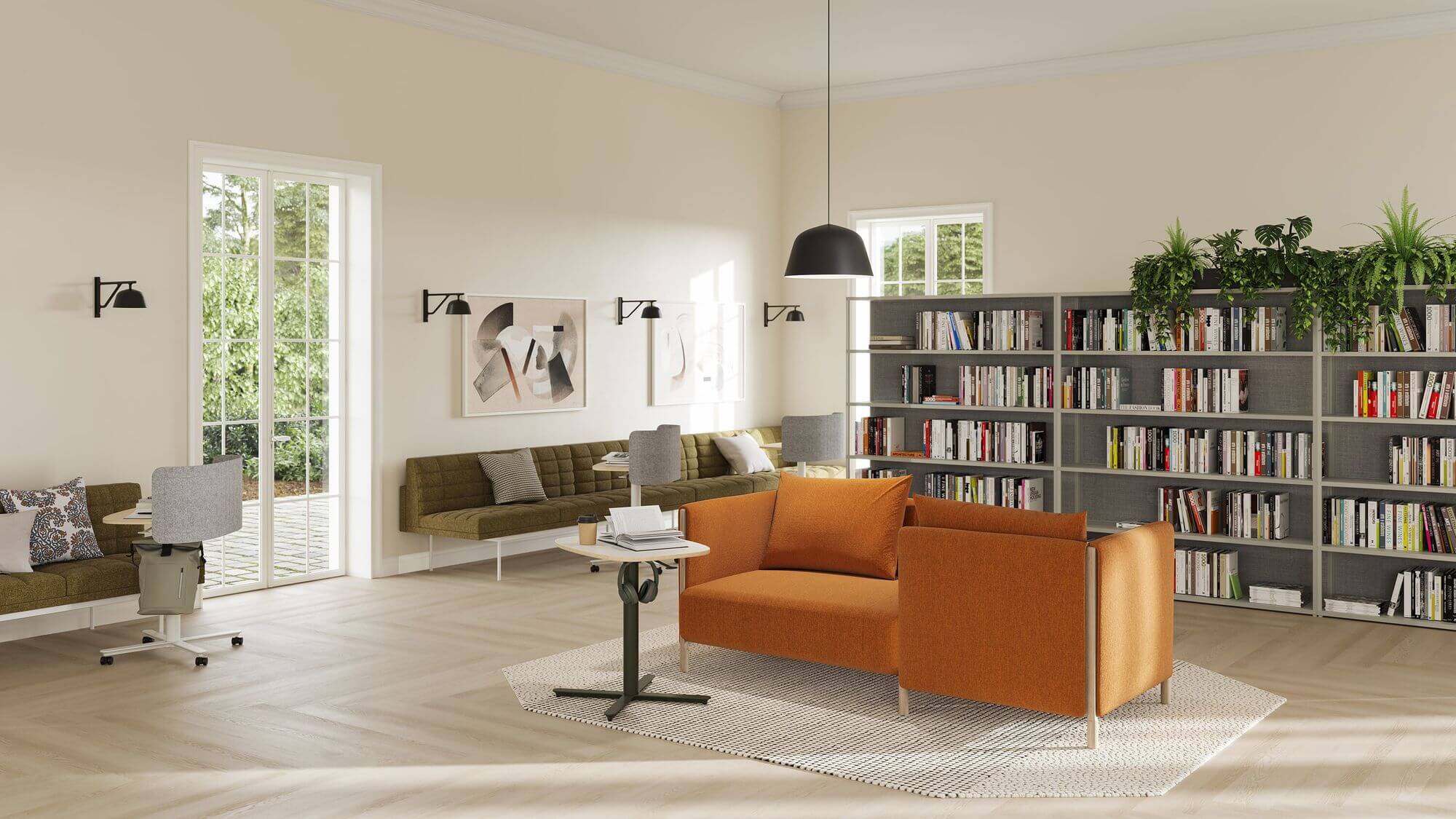 a modern library room featuring a book shelf and two red ColourForm Sofa Group next to a side table