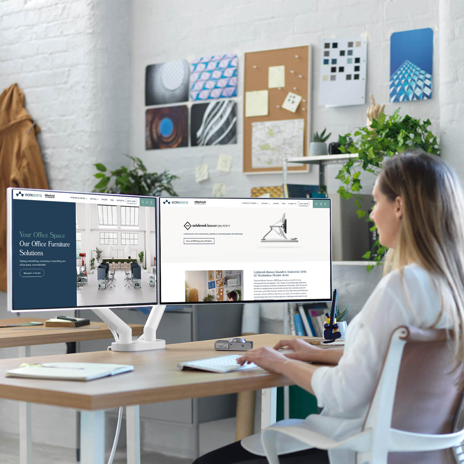 Flo Dual Ergonomic Monitor Arm designed by australian furniture designer brenda saunders with a person typing on a keyboard in the right side