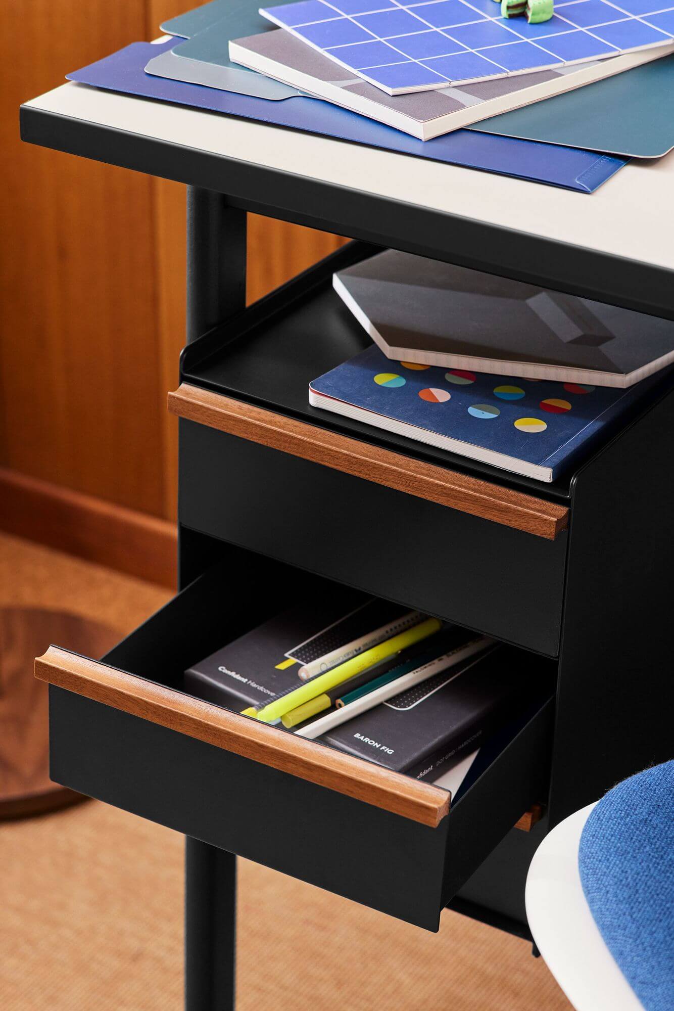 an open drawer of a Mode Wooden Top Desk