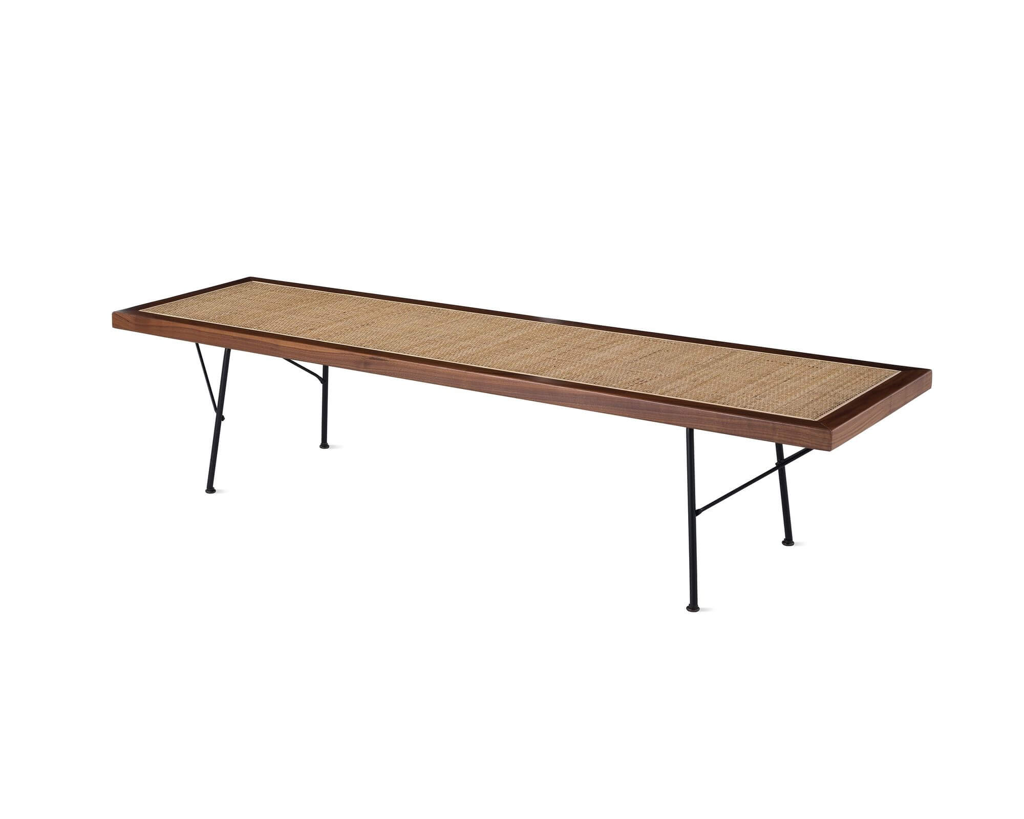 the front side angle of an oak Nelson Cane Wooden Bench in a white room