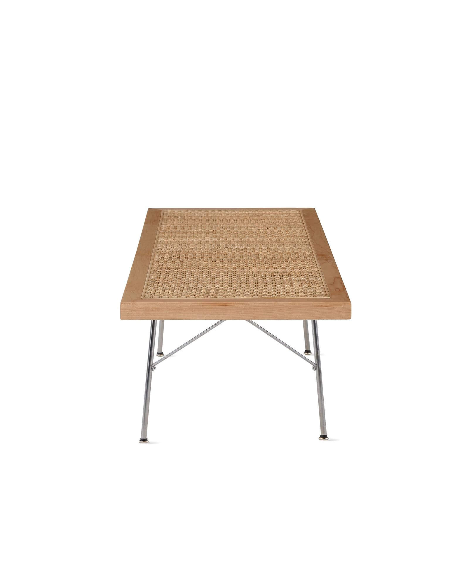 the left side of a Nelson Cane Wooden Bench in a white room