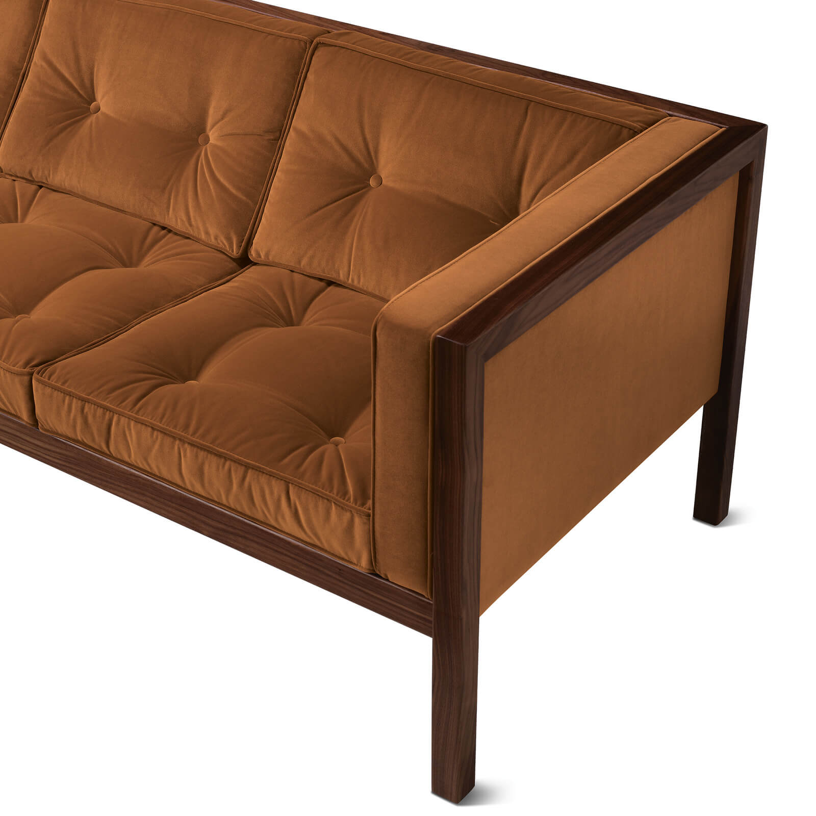 the right arm detail of a Nelson Cube Wooden Frame Sofa in a white room