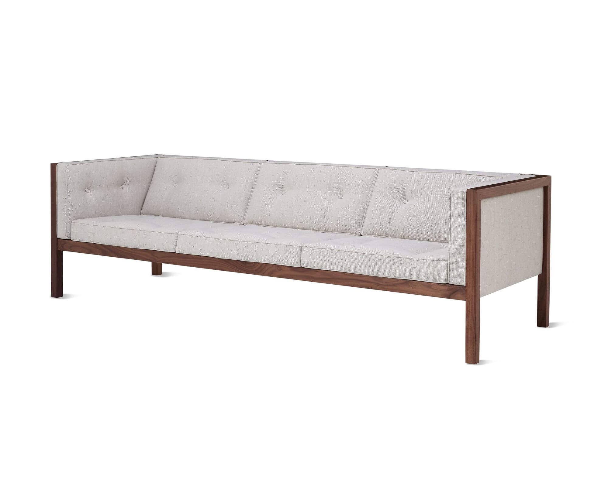 the left side angle of a Nelson Cube walnut Wooden Frame Sofa with grey upholstery in a white room