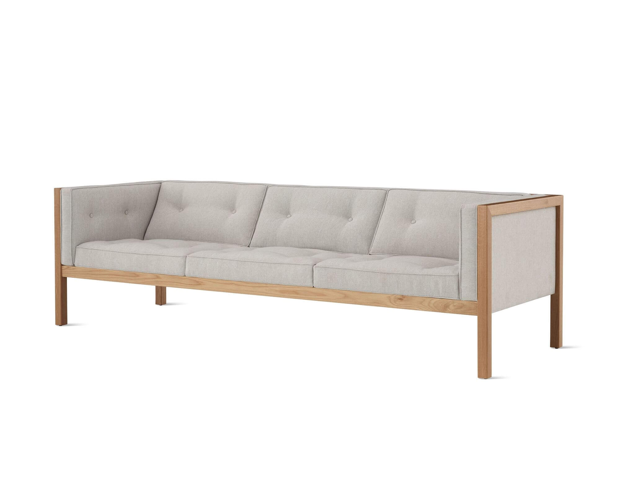 the left side angle of a Nelson Cube oak Wooden Frame Sofa with grey upholstery in a white room