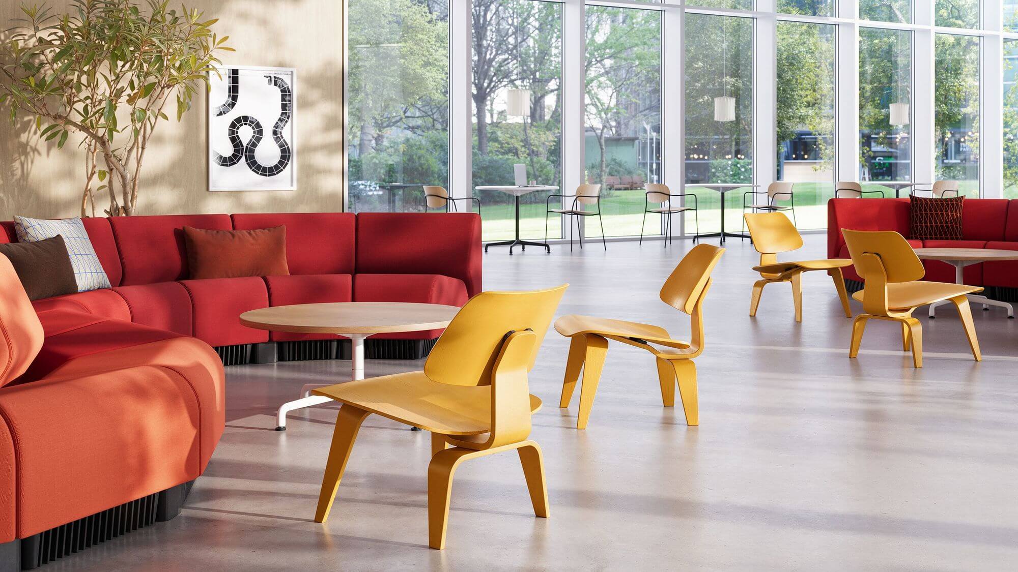 a modern office lobby featuring side wooden chairs and a Chadwick Modular Lounge Seating in red colour and tall windows in the background