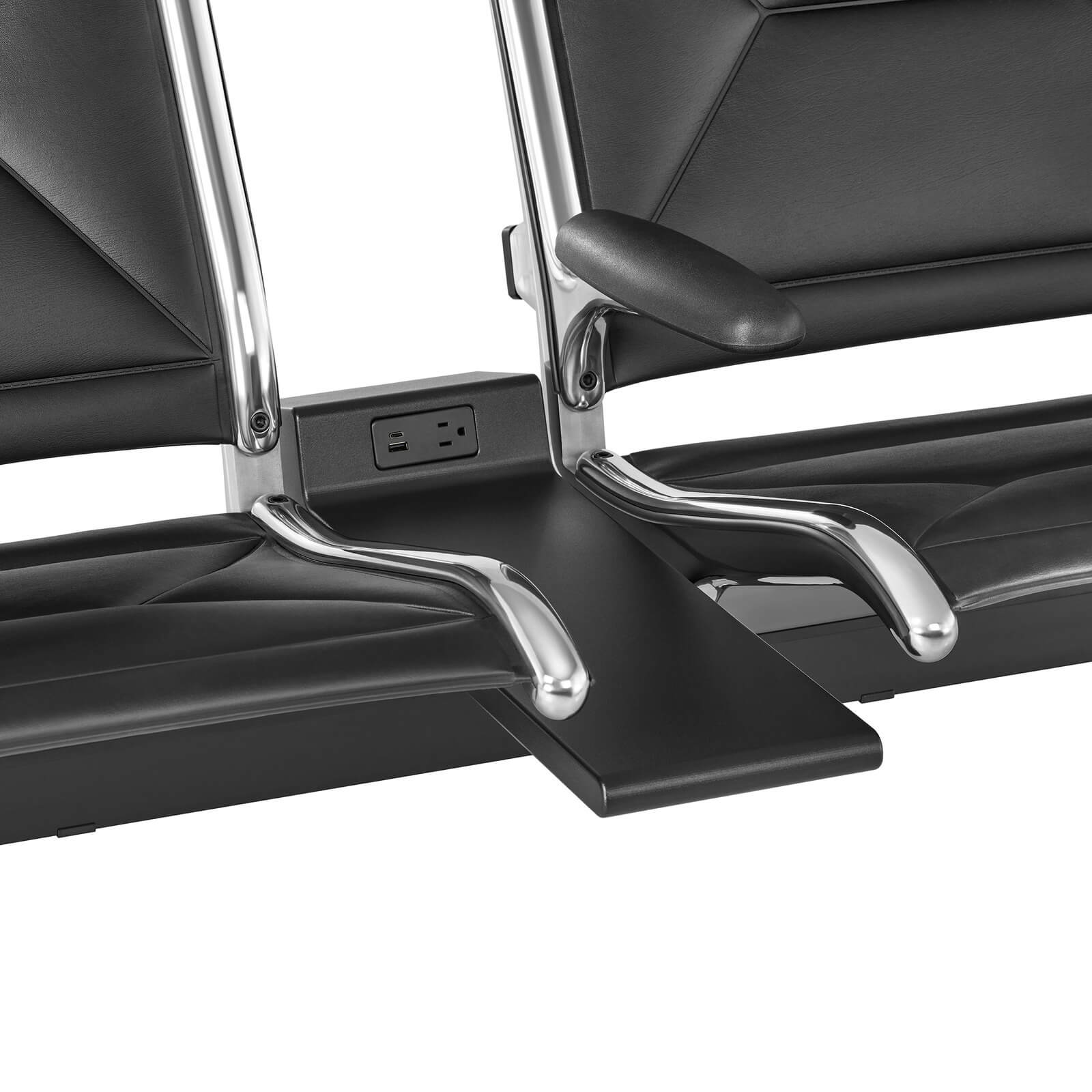 the front angle of a Eames Tandem Sling Lobby Seating power connection with leather upholstery and polished frame in a white room