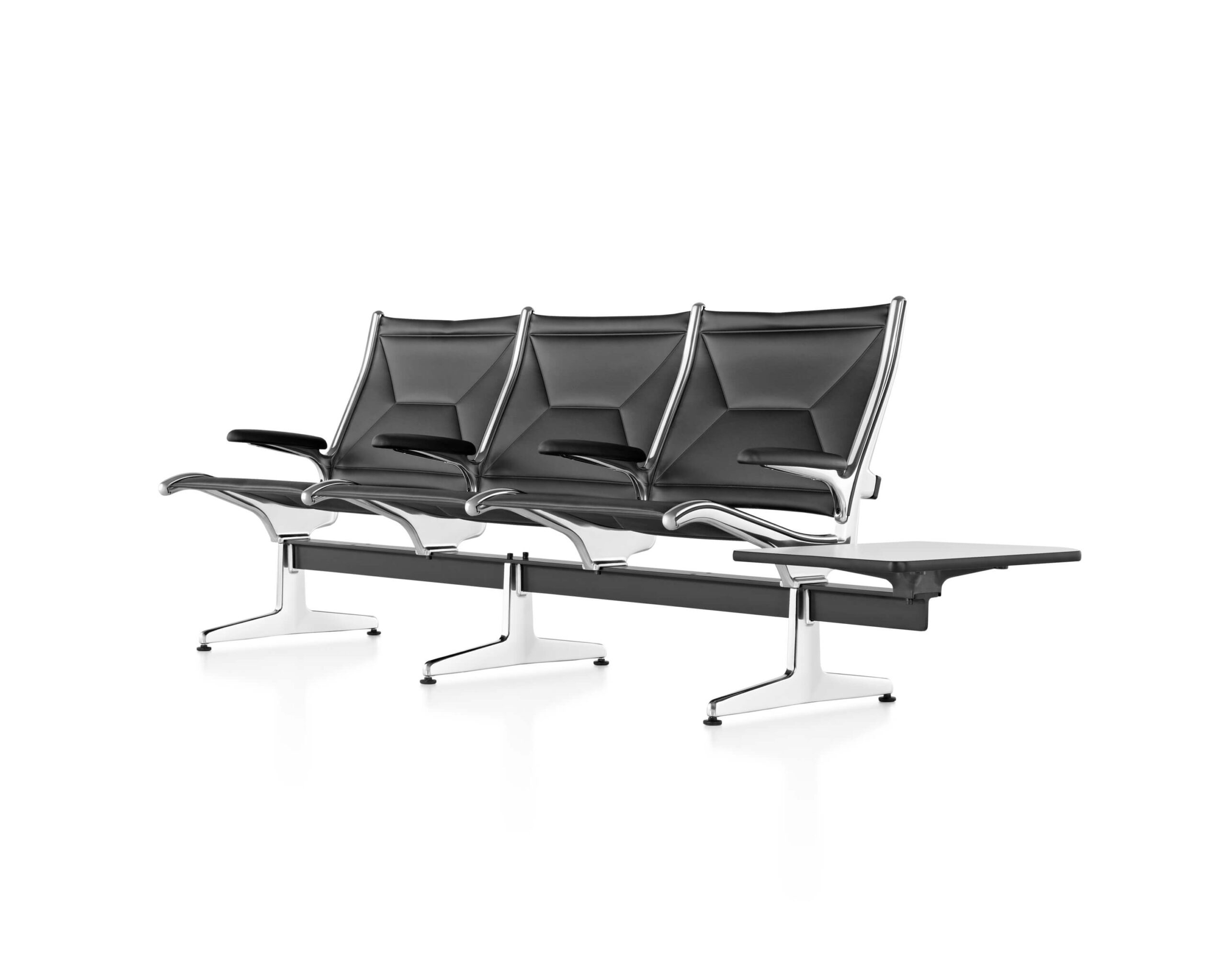 the front right angle of a three seats Eames Tandem Sling Lobby Seating with leather upholstery with a side table attached and polished frame in a white room