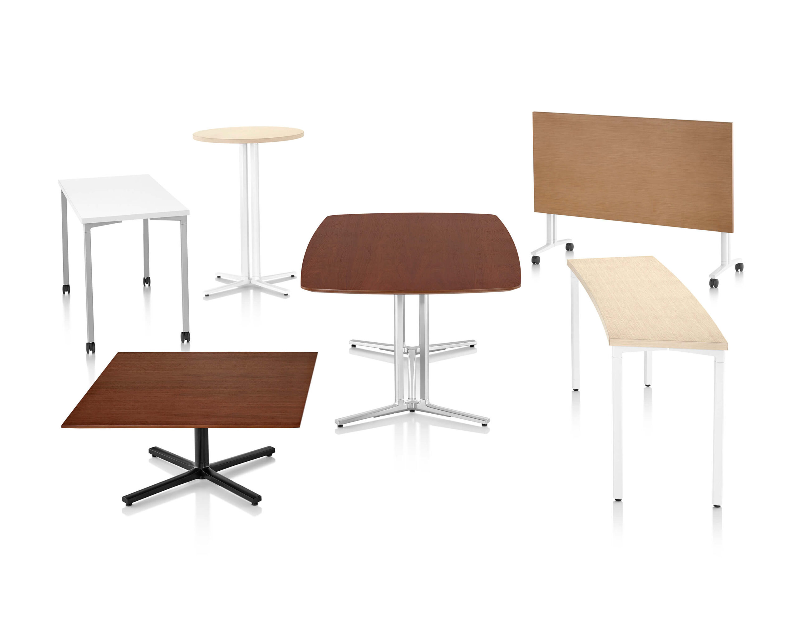 a set of various Everywhere Multi-Purpose Tables with different styles and finishings in a white room
