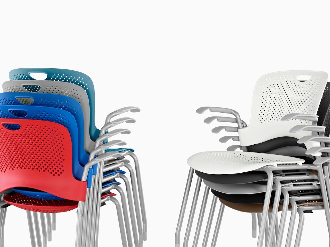 top details of eight colourfull caper stacking barstools in a white room