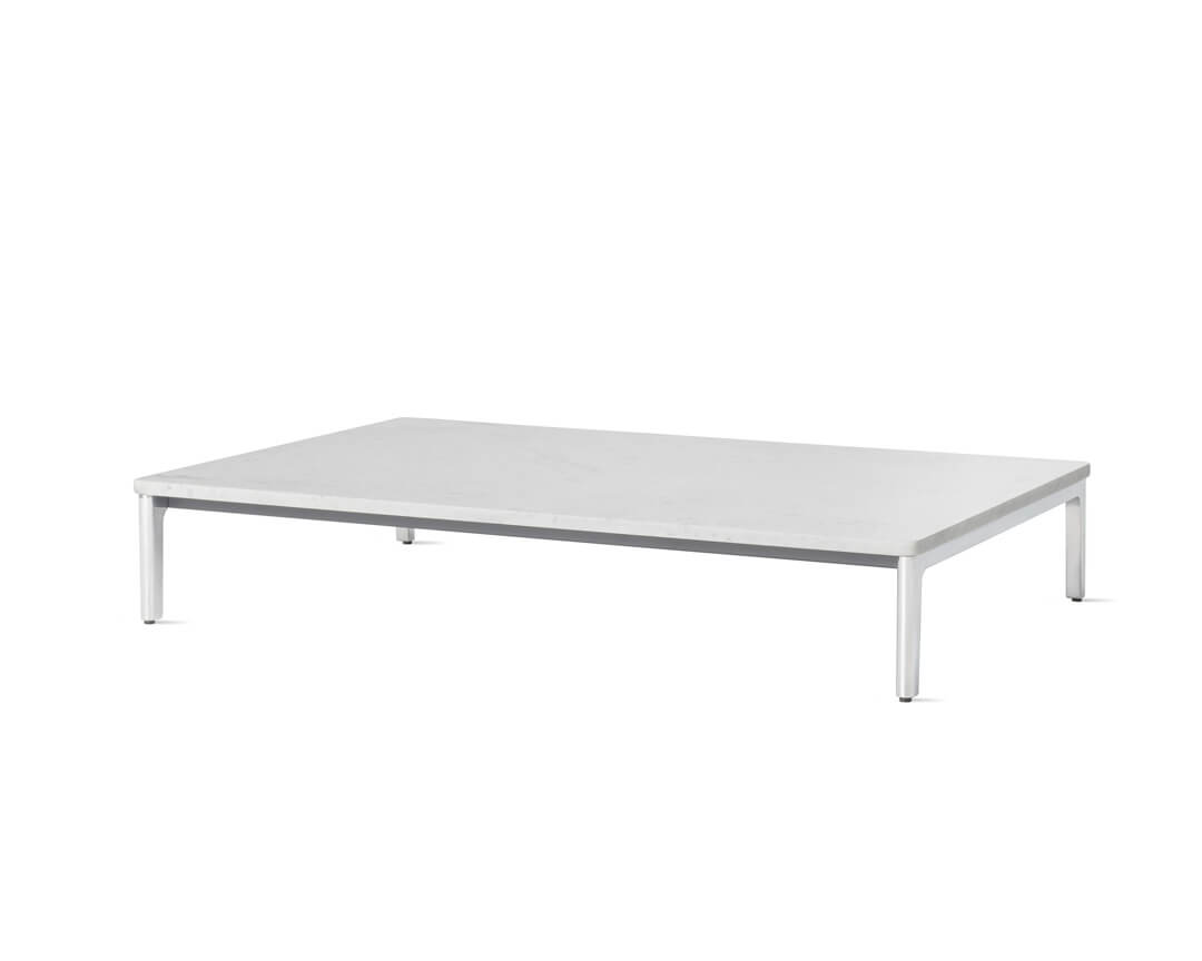 the side angle of a long mimo side coffee table naughtone with white marble wood top in a white room