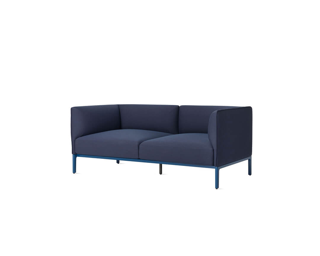 a blue two seats mimo sofa naughtone in a white room