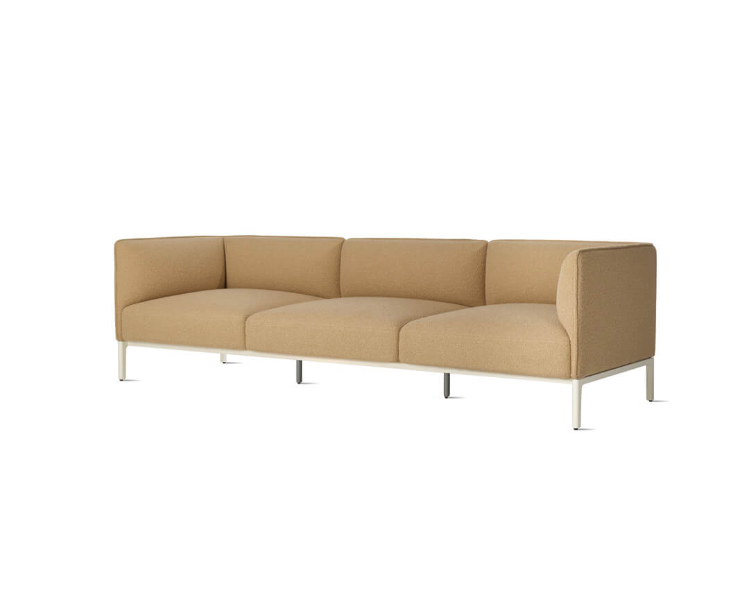 the side angle of a peach colour three seater mimo sofa naughtone in a white room