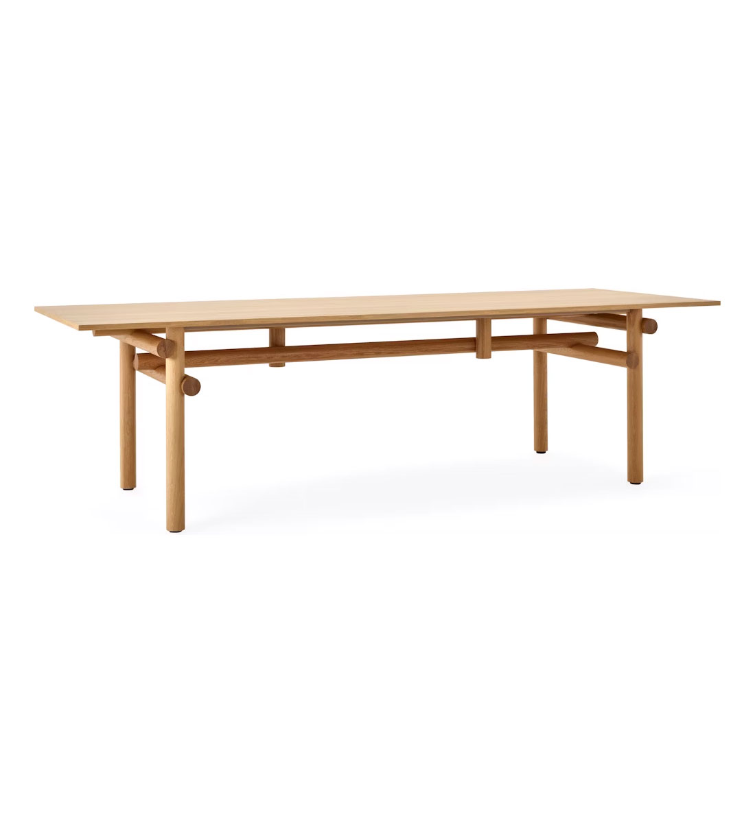 the front side angle of a wooden Muecke dining table by knoll in a whte room