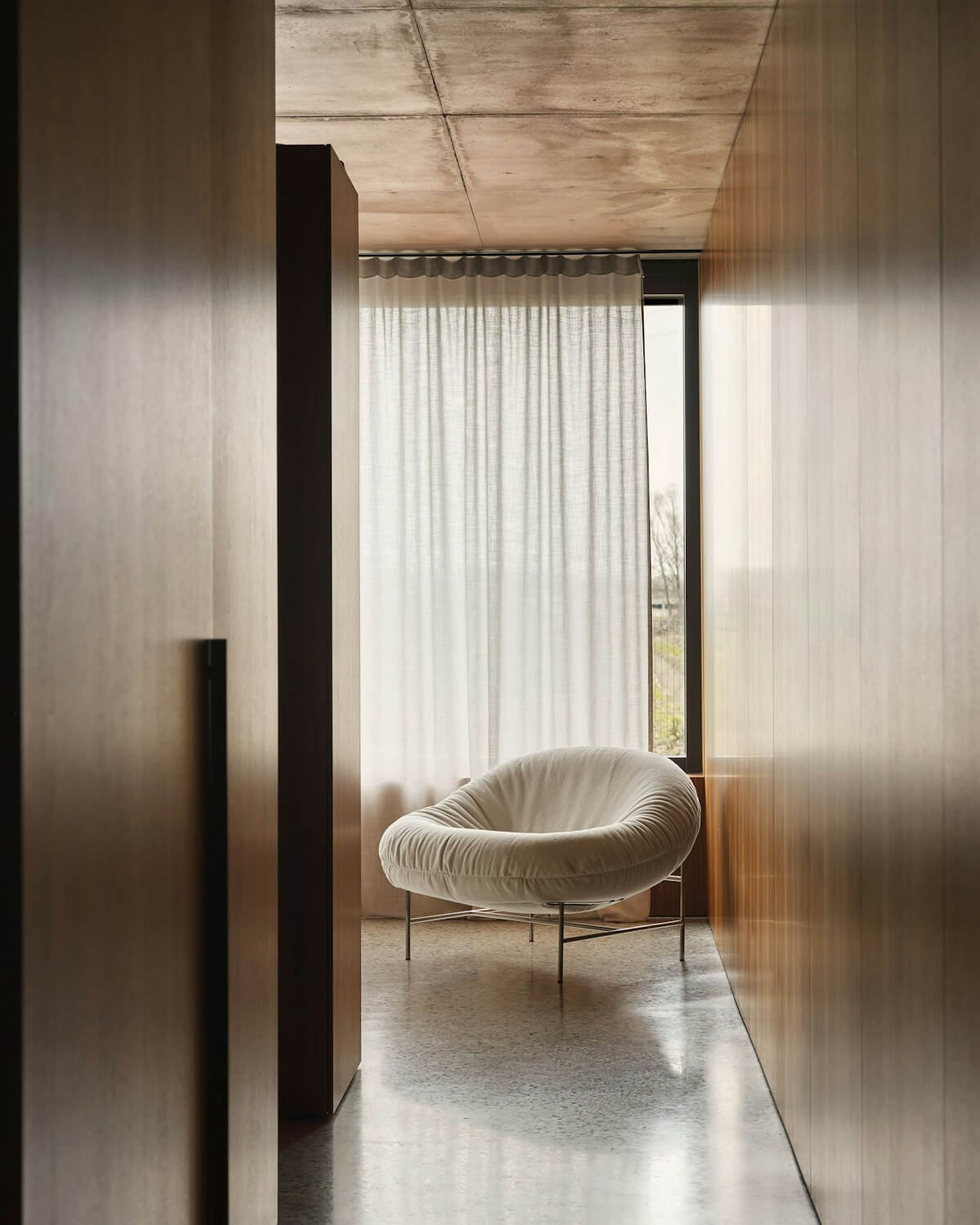 Perron Bun Lounge Chair and Ottoman knoll in a living room in sydney
